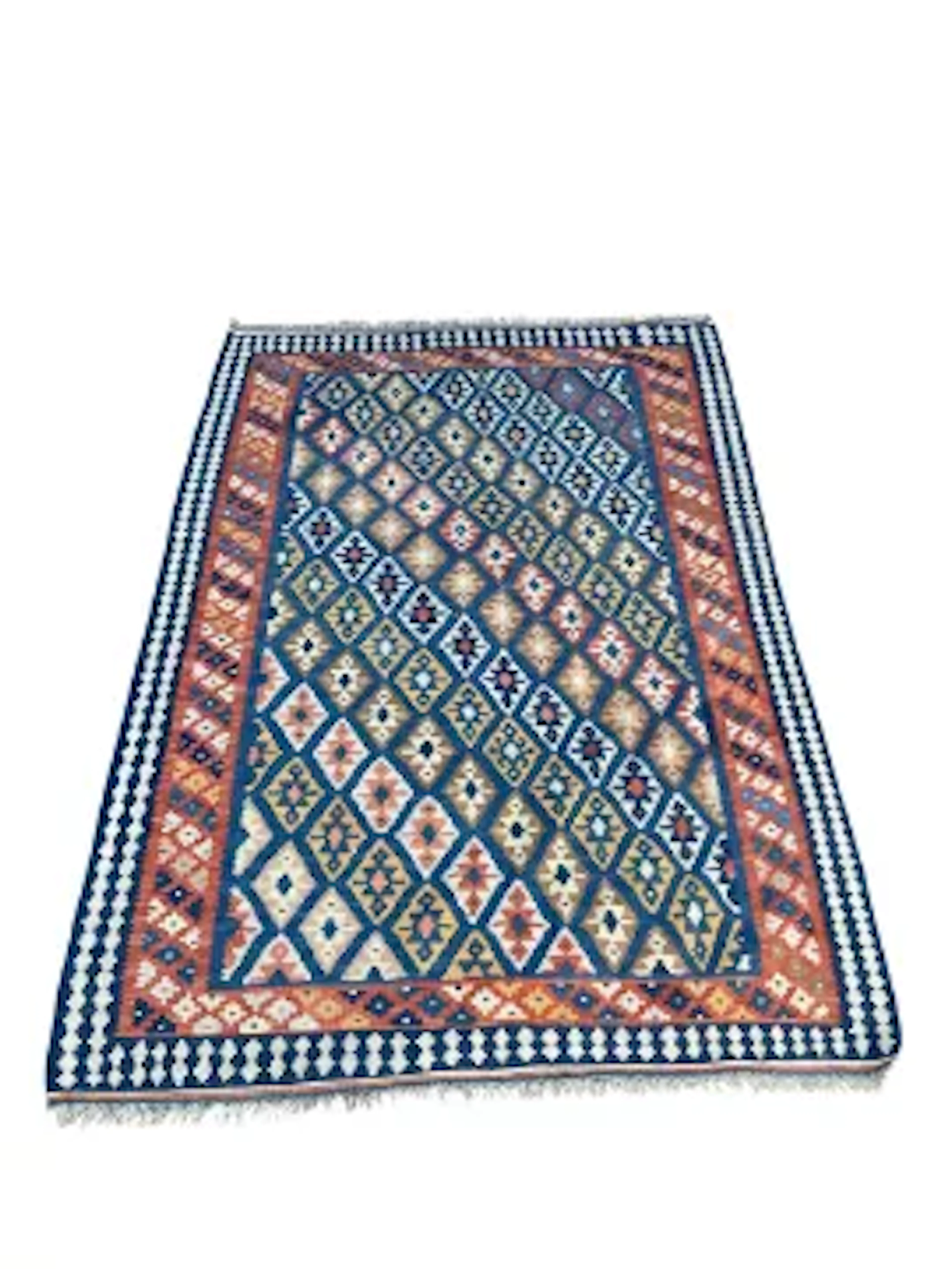 A flatweave Kelim with repeating lozenge decoration on a pale sapphire