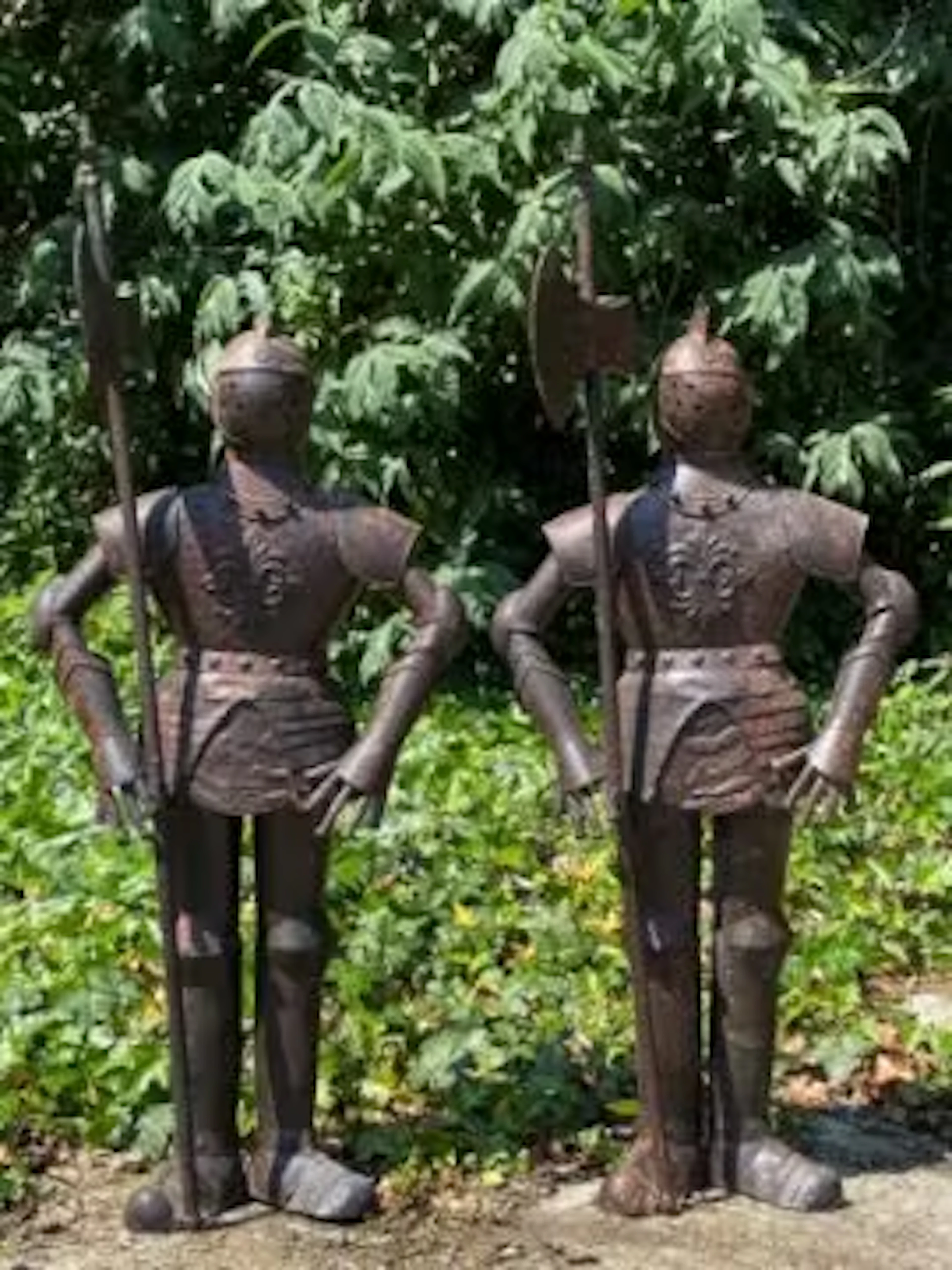 A pair of miniature suits of armour, plate metal French medieval style