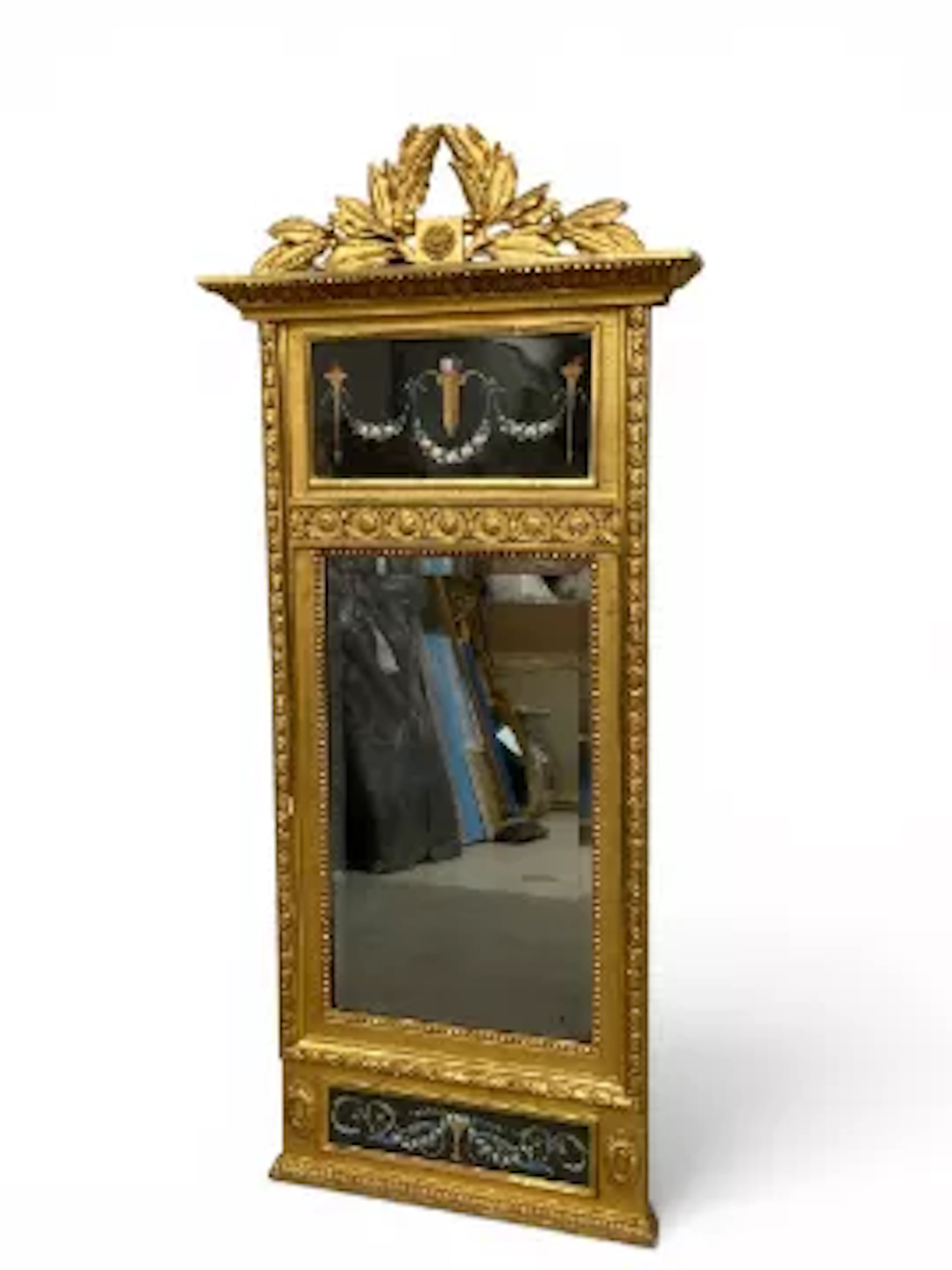 A 19th century Empire style pier mirror with carved giltwood leaf