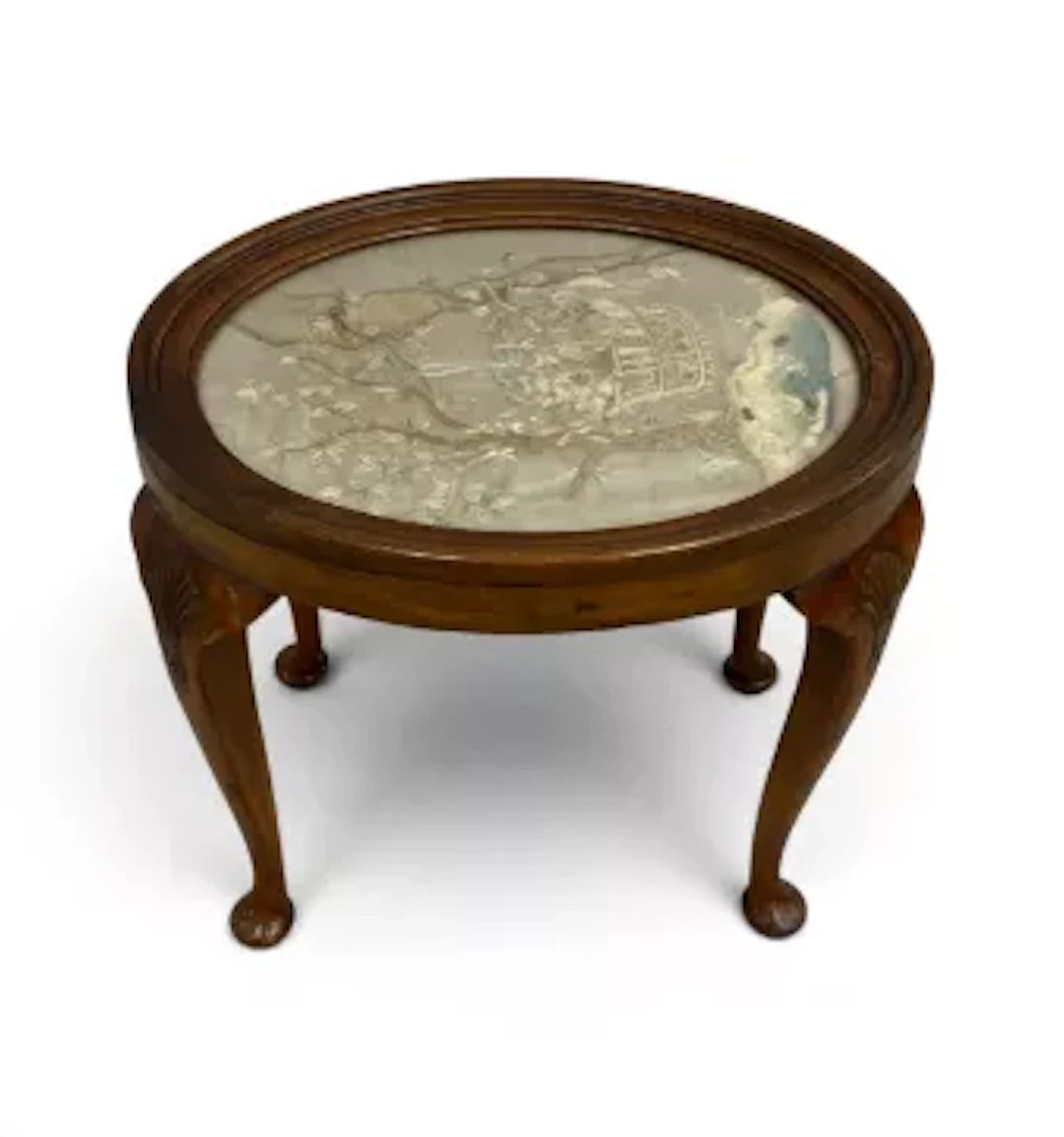 A C.1900 mahogany occasional table with plate glass inset embroidered