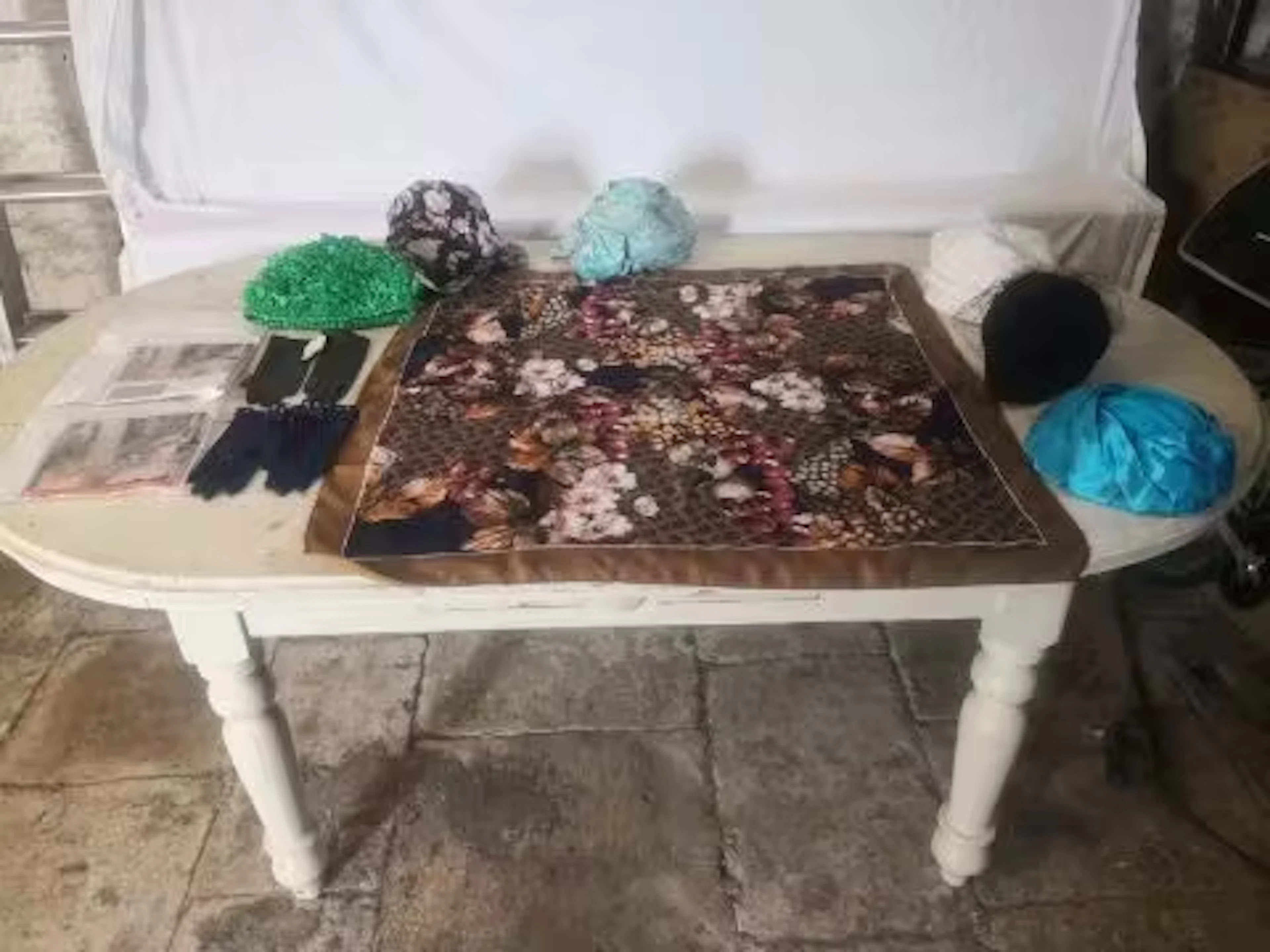 A mixed collection of vintage ladies dress items to include a pair