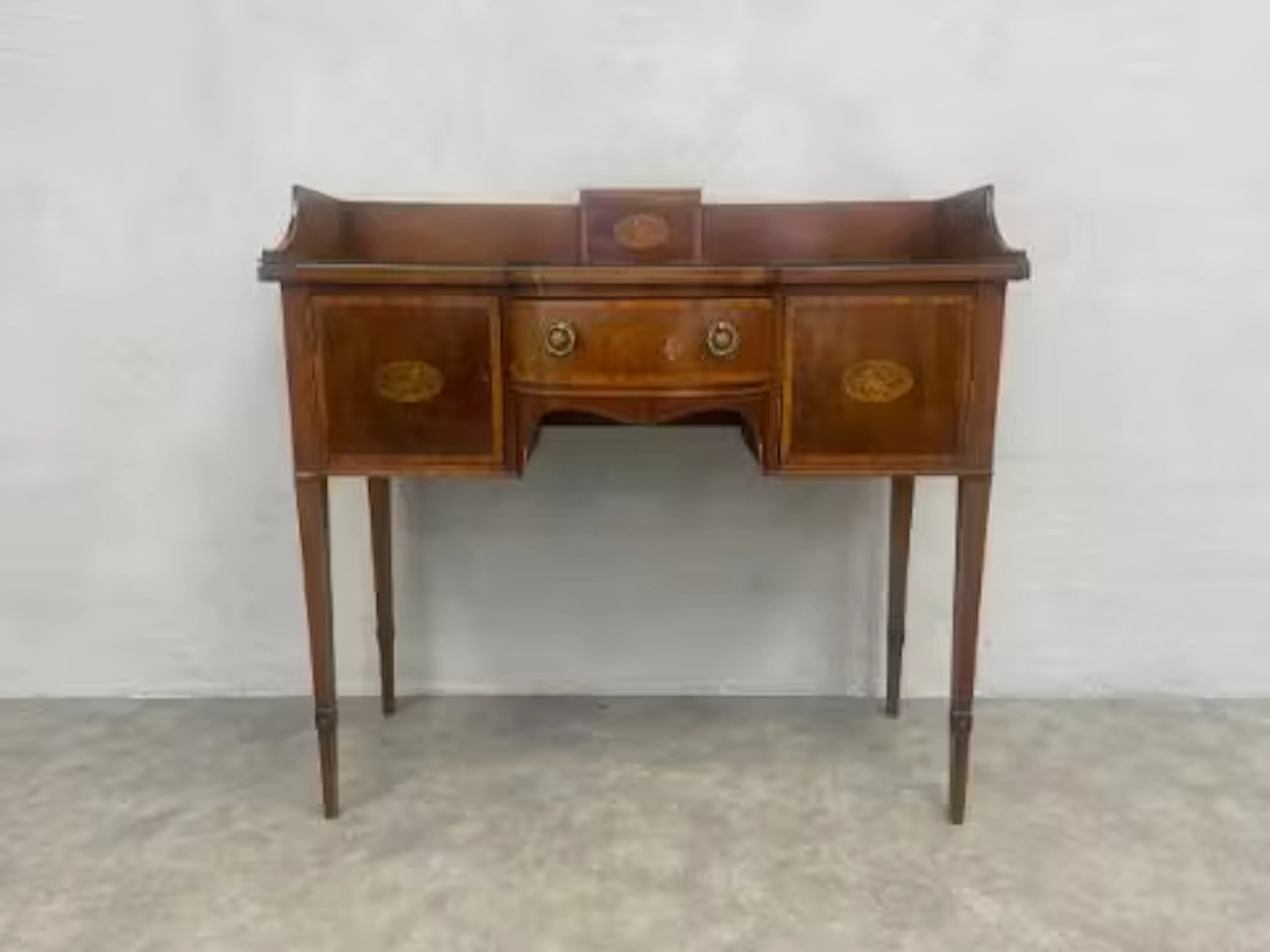 A compact Edwardian mahogany sideboard with satinwood banding and