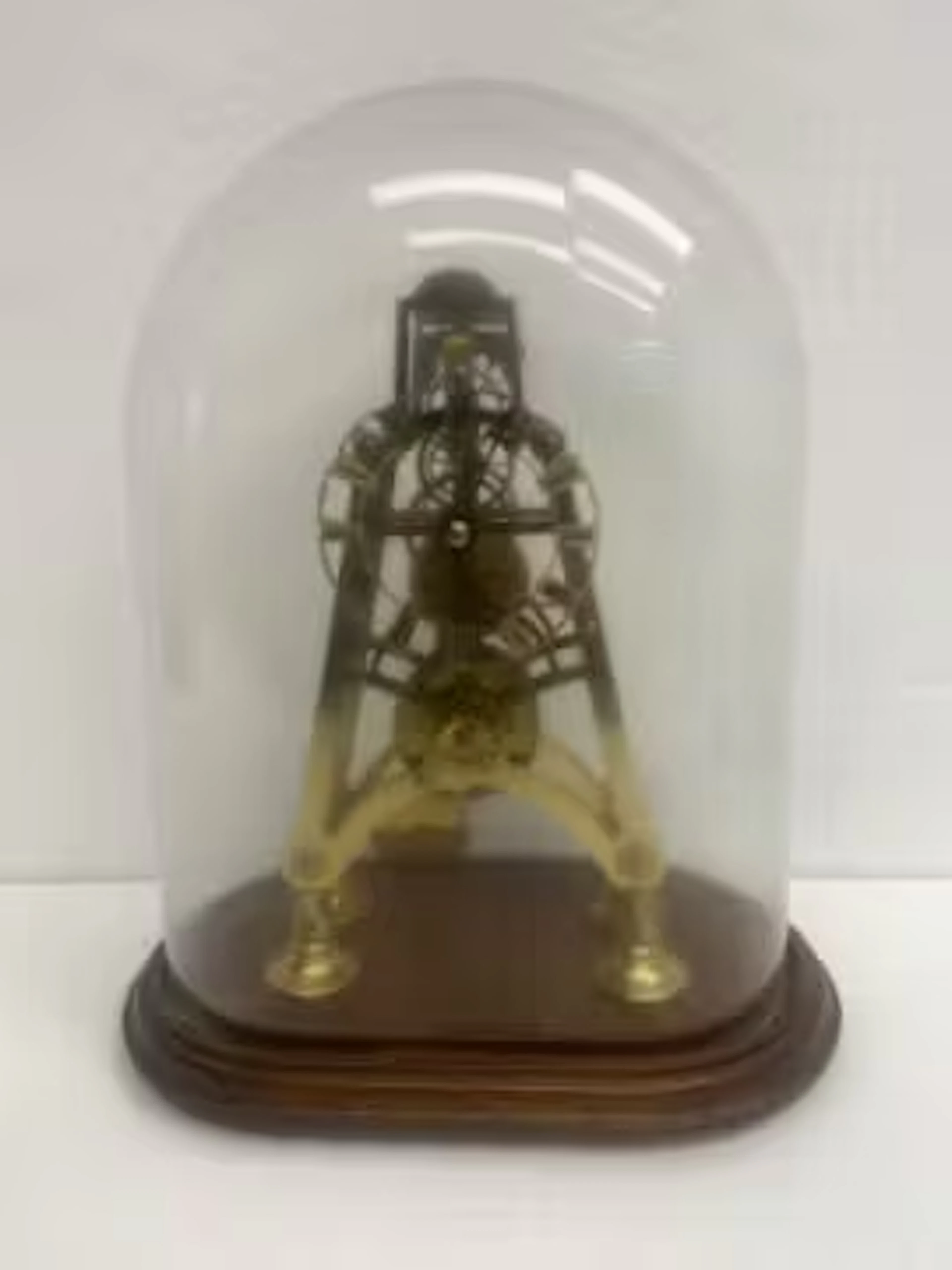 A skeleton clock with gilt metal plates of pylon form, cord driven
