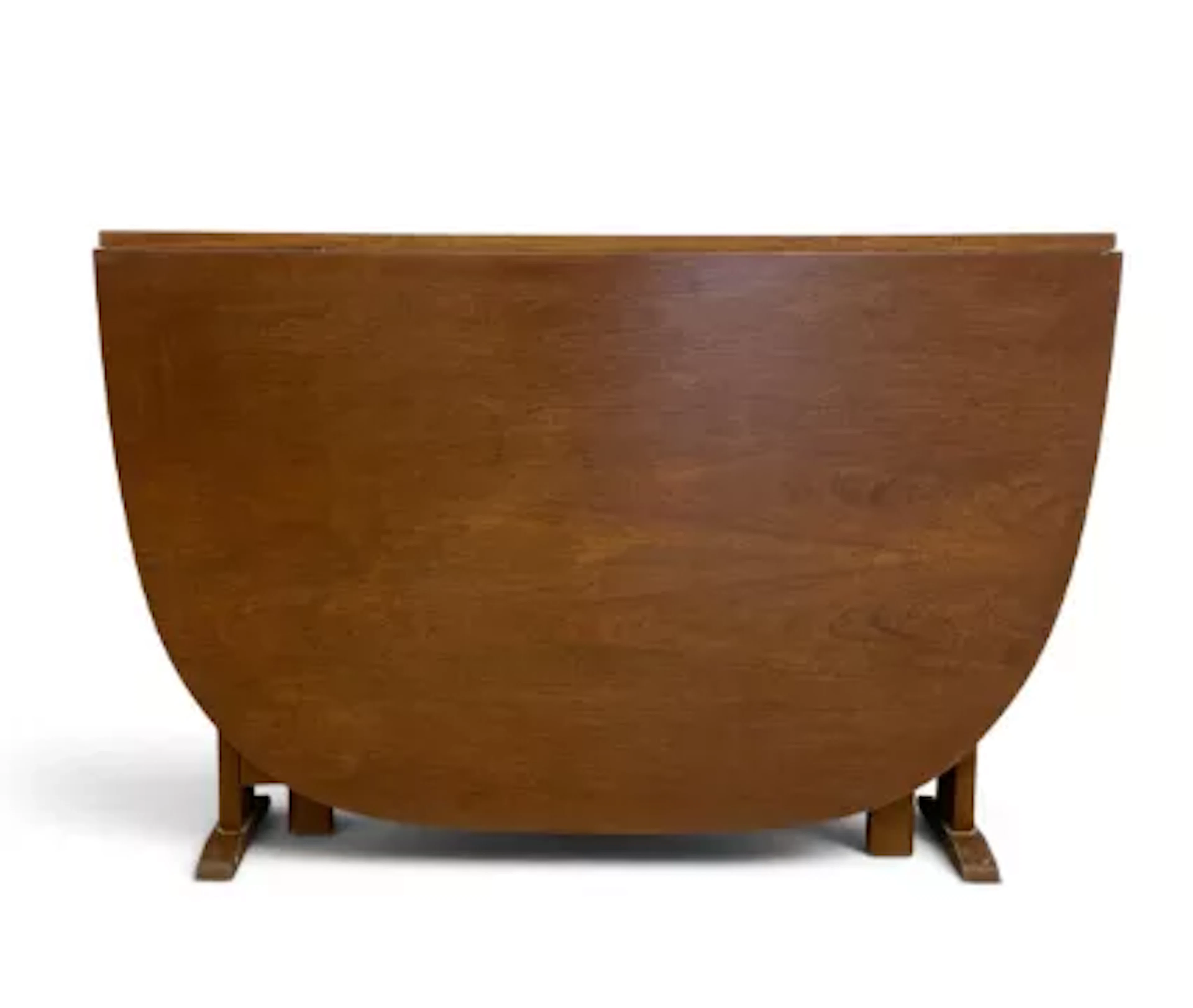 A mid century teak narrow gateleg dining table with deep drop flaps.