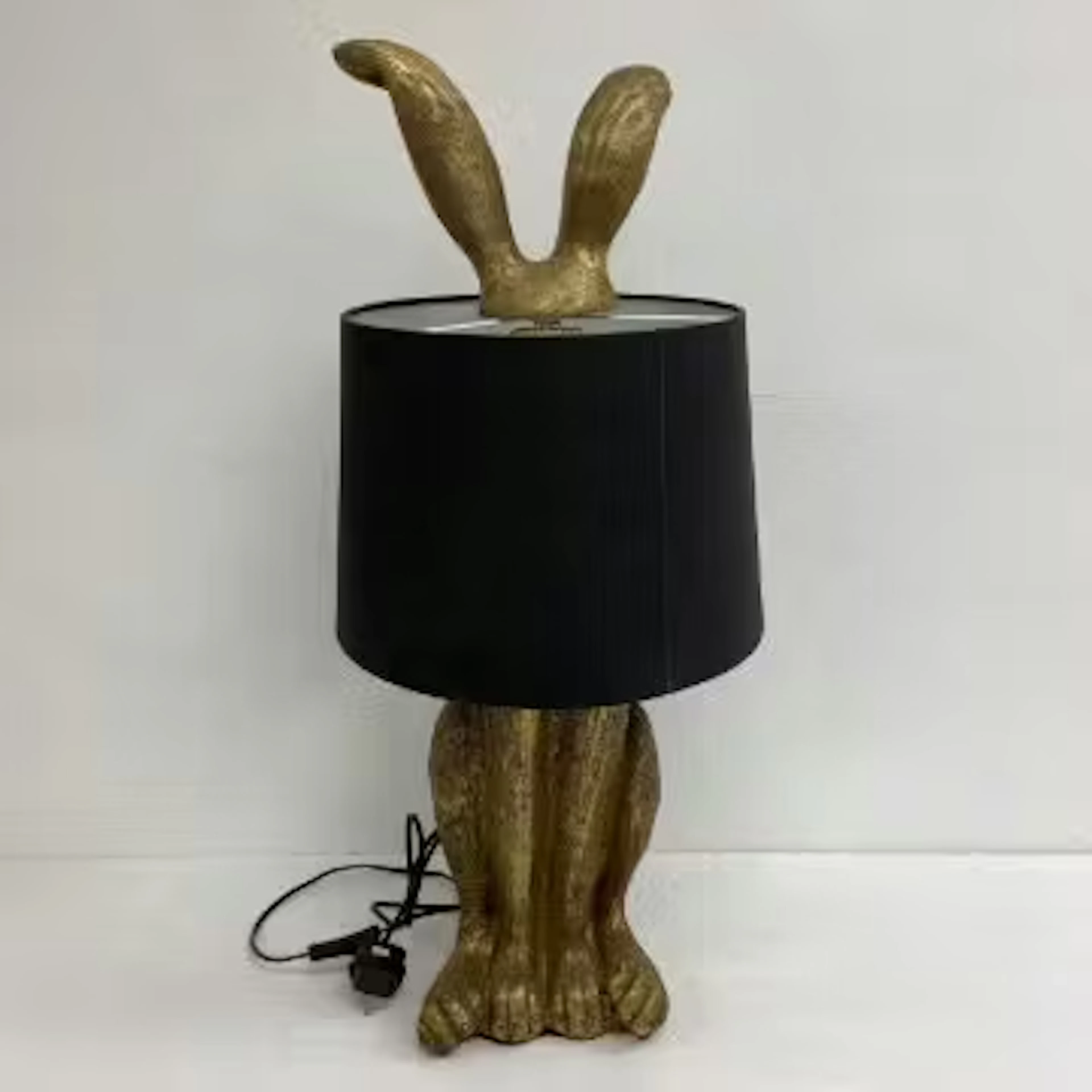 A contemporary figural rabbit lamp with shade. H.76cm.