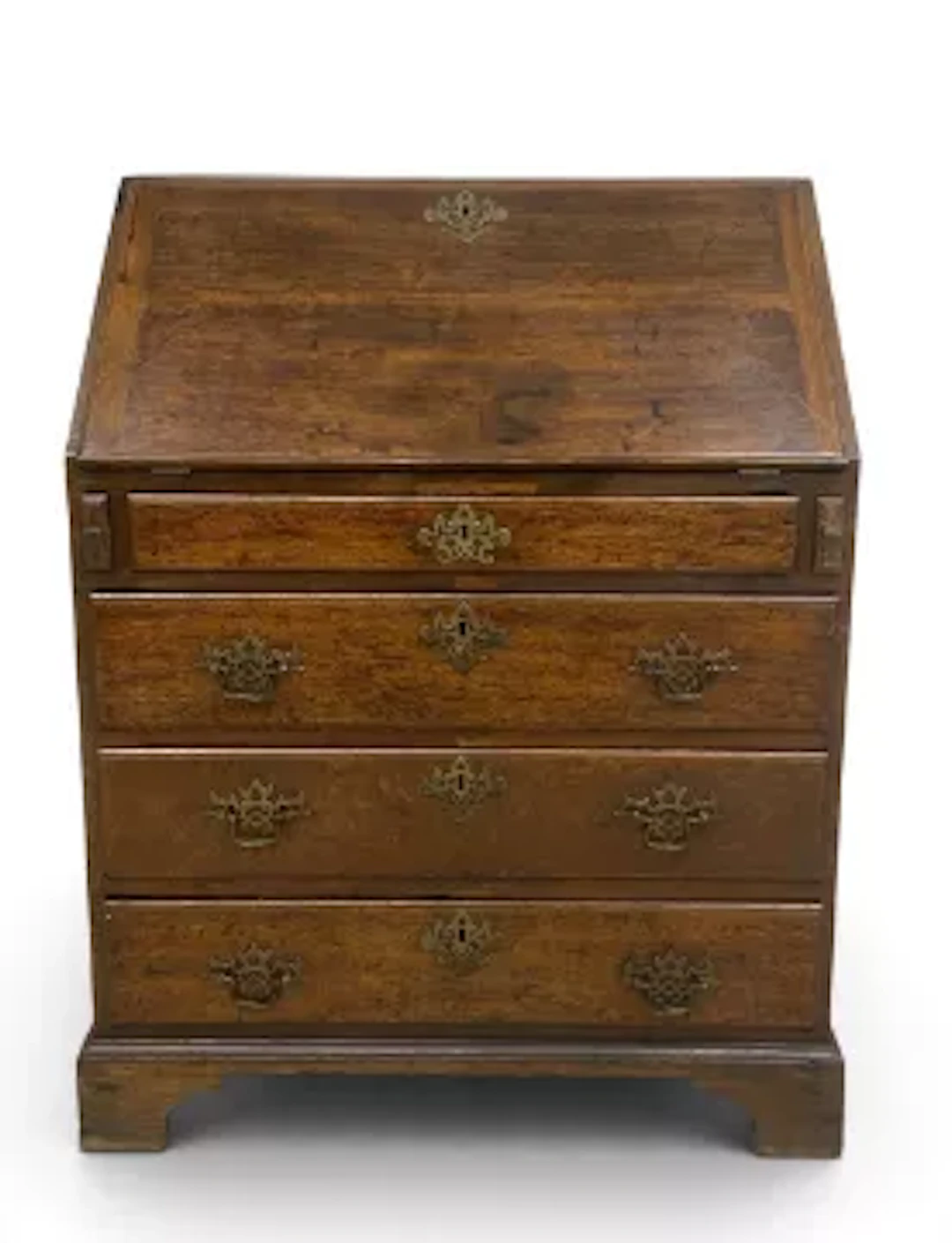 A small Georgian oak bureau desk having a fall front with fitted interior