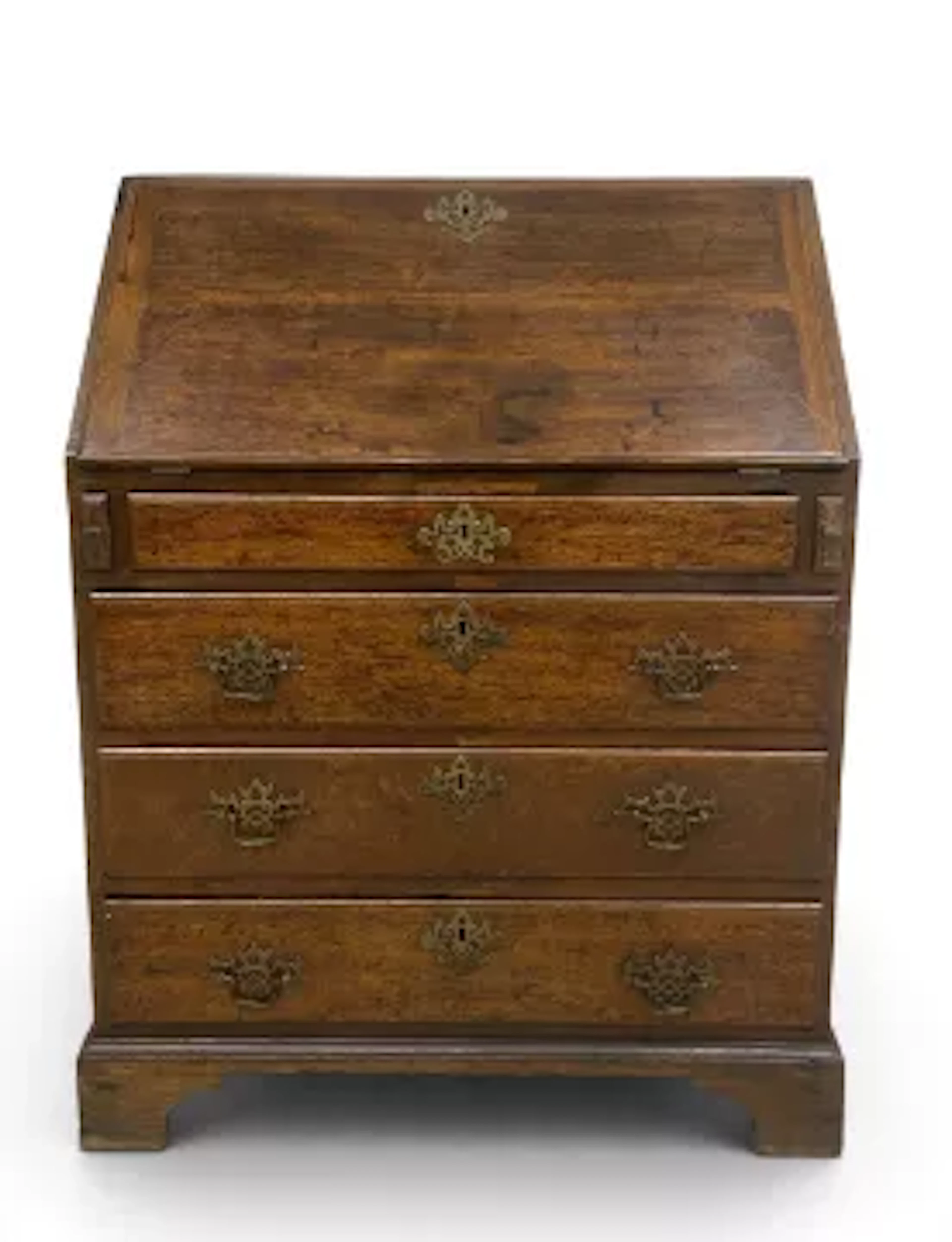 A small Georgian oak bureau desk having a fall front with fitted interior