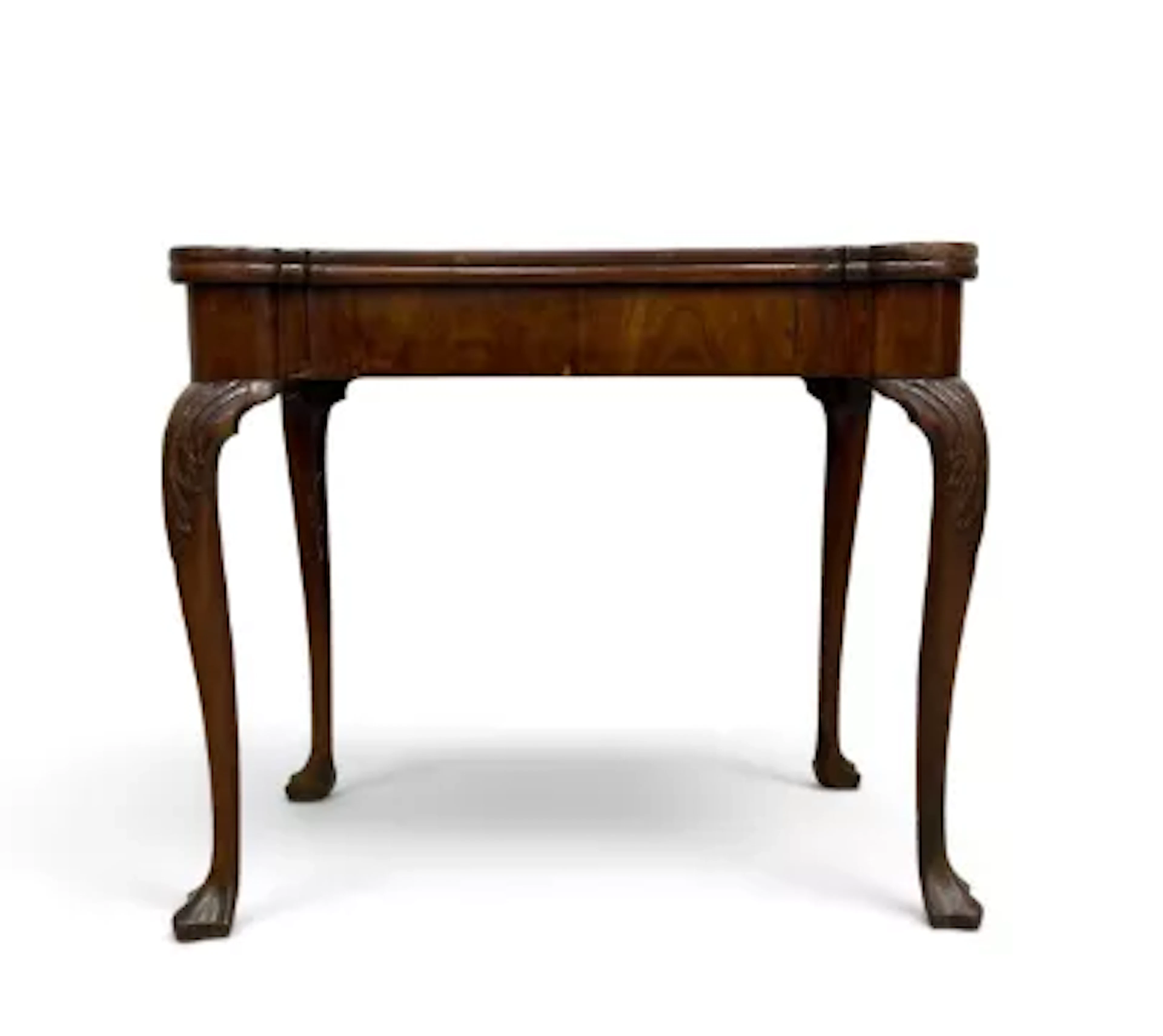 A mid Georgian mahogany card table with foldover top revealing baize