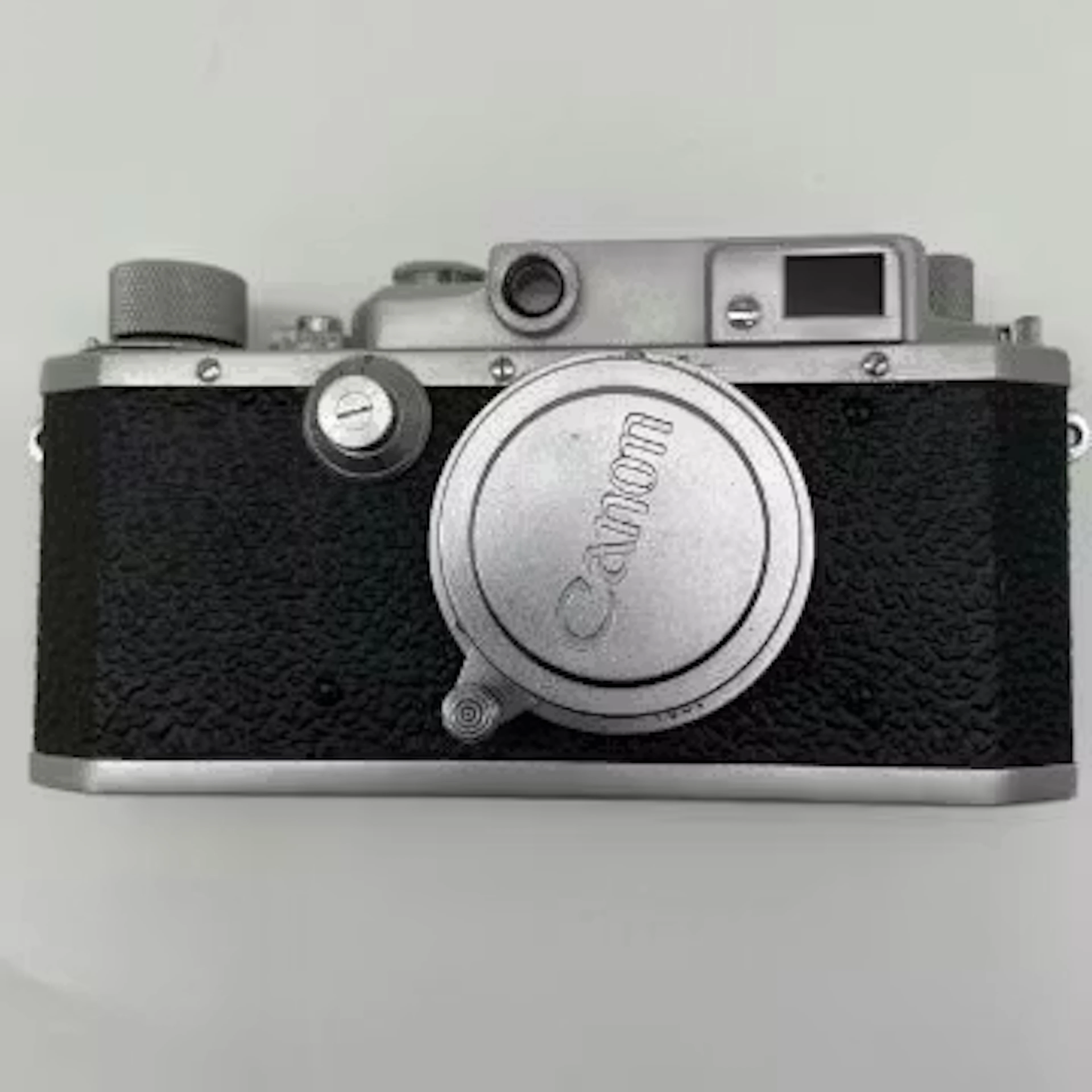A 1950s vintage Japanese metal cased bottom-loading Canon Camera Co.