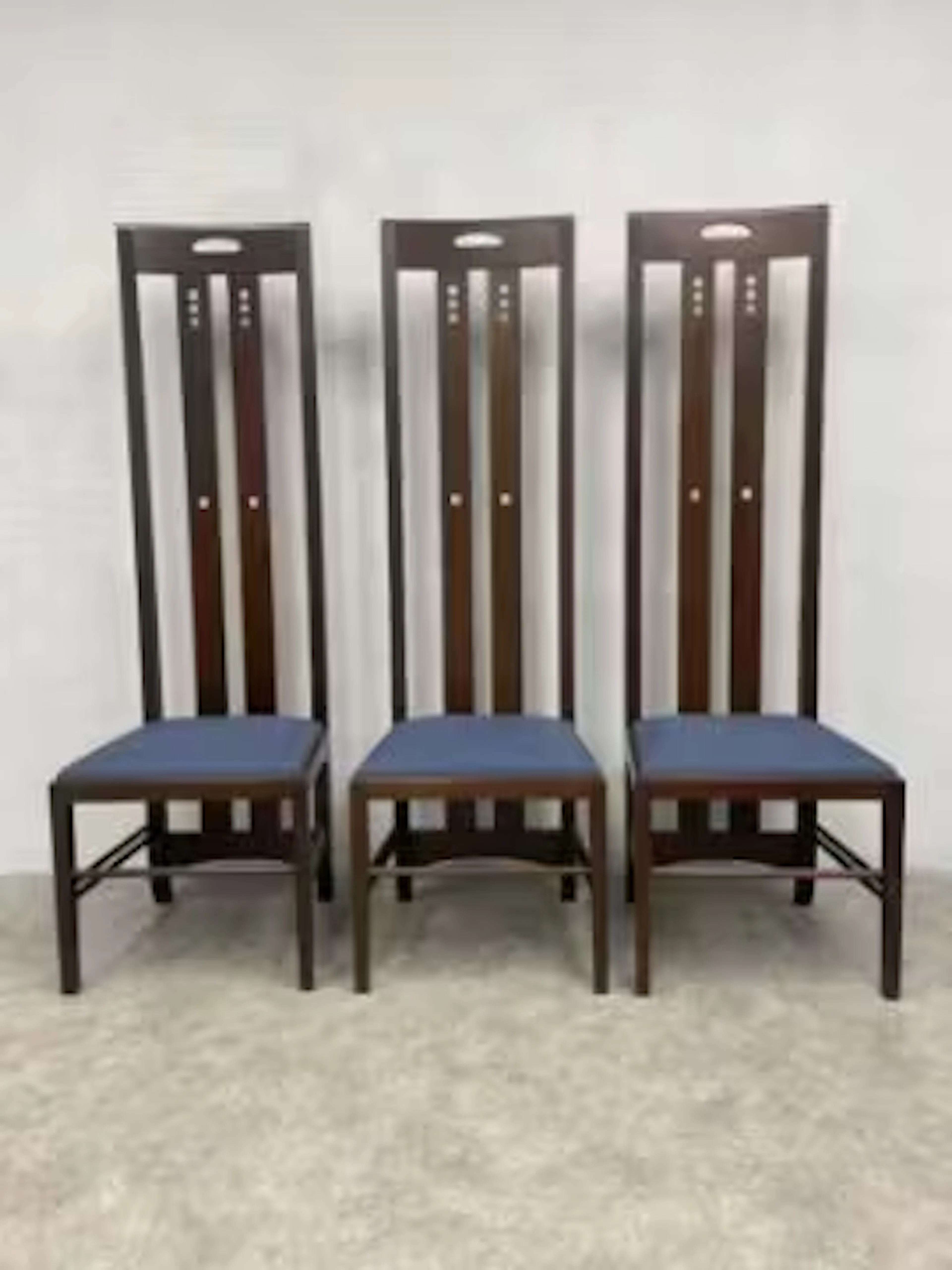Three MacKintosh Ingram chairs by Cassina with stamps and labels.