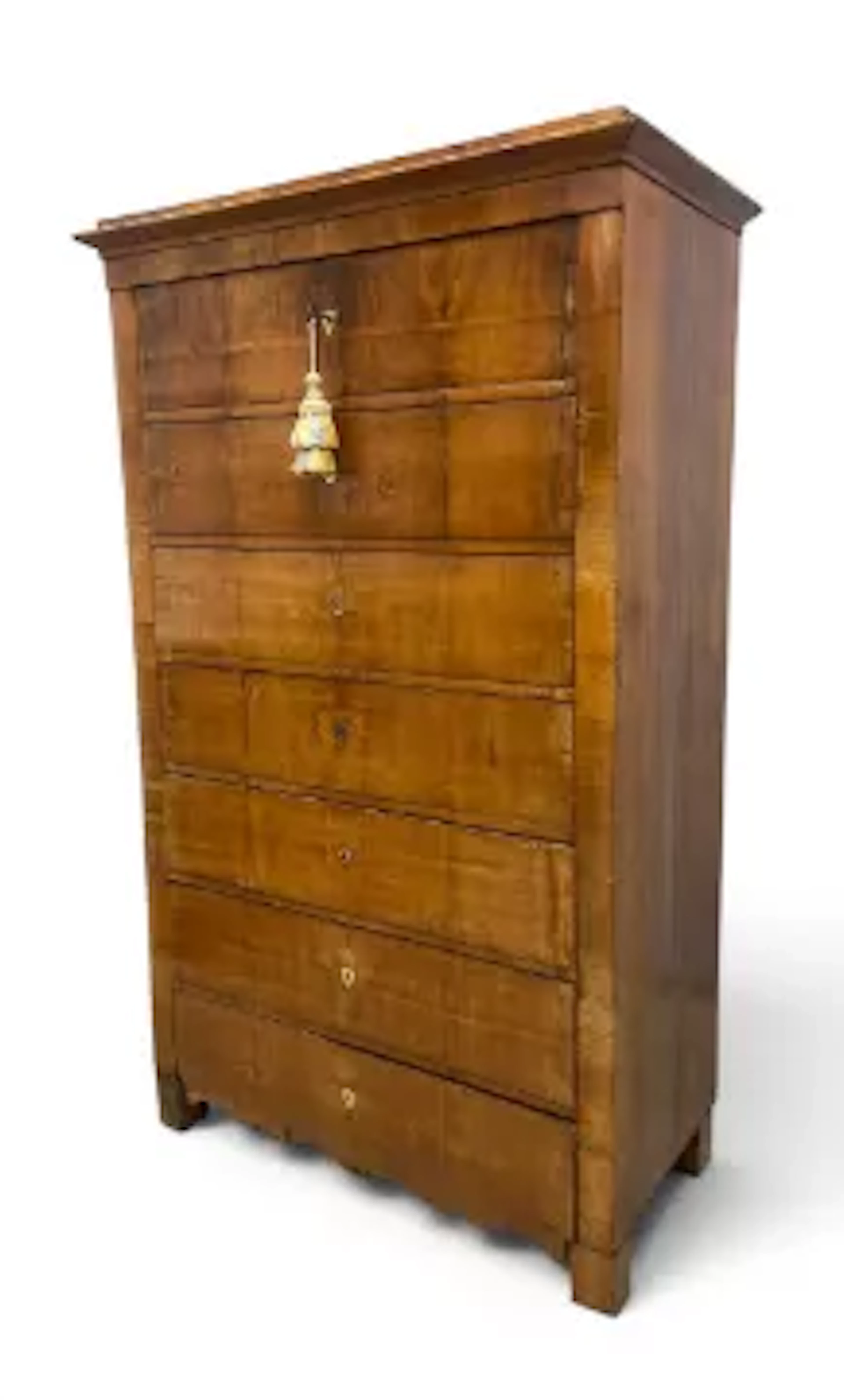 A 19th century Biedermeier satinwood tall chest of seven drawers with