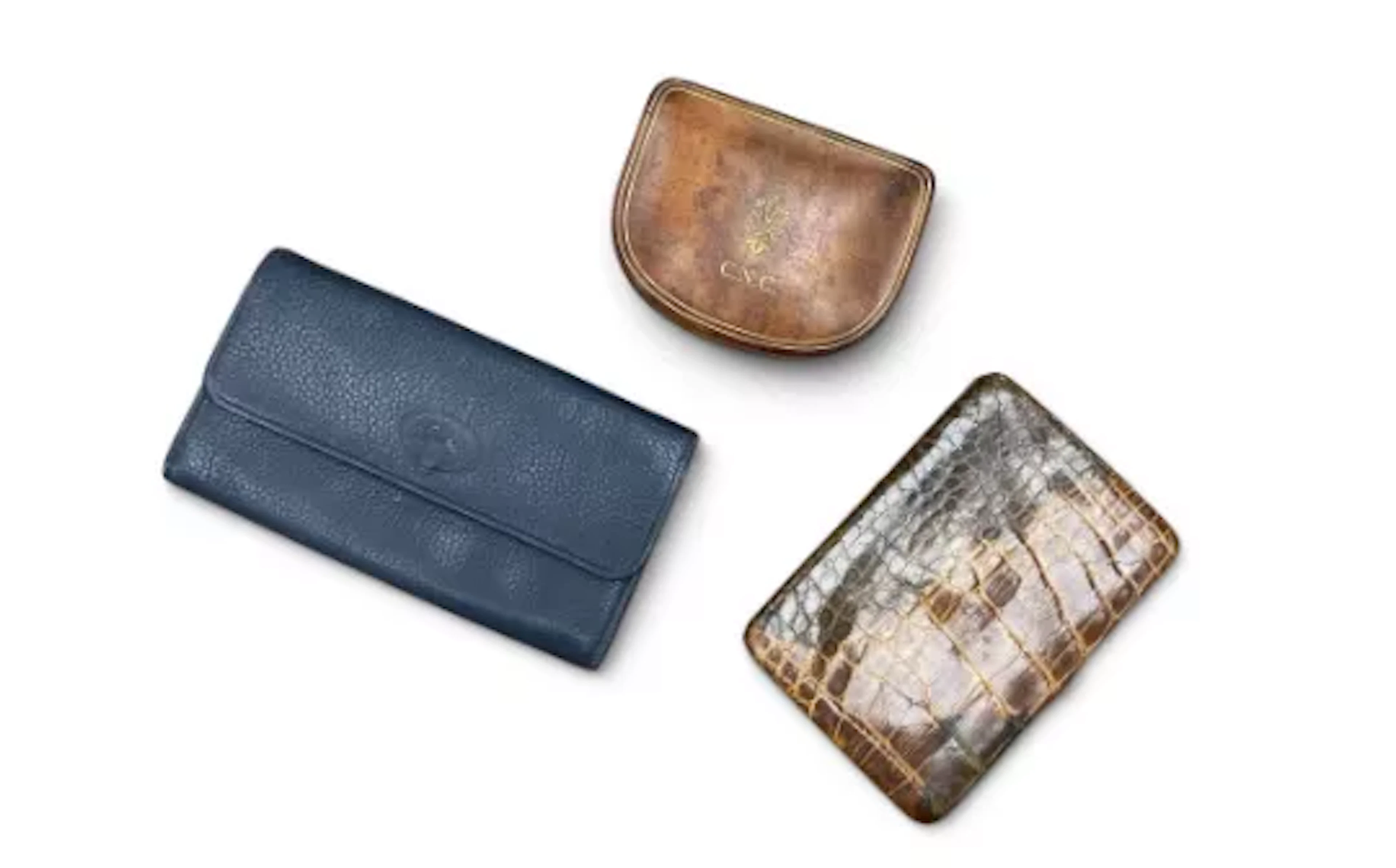 A collection of early 20th century leather wallets, purses and a jewellery