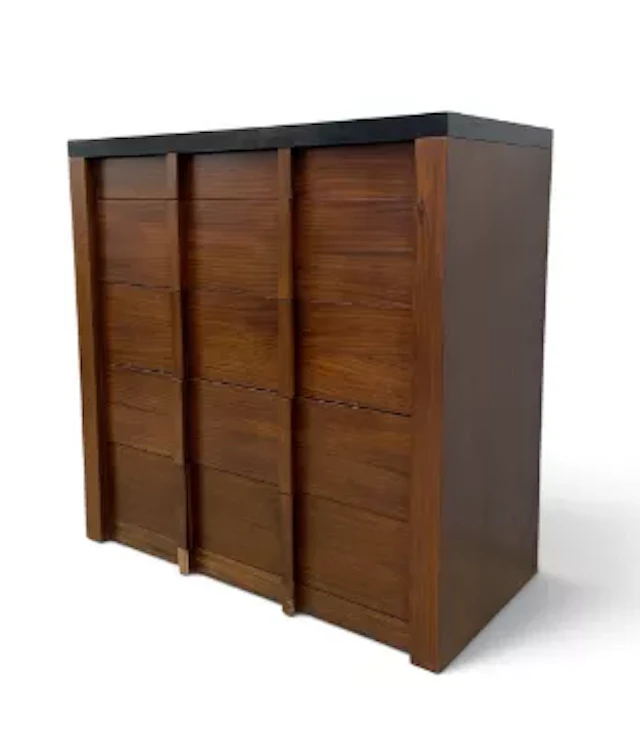 A contemporary teak chest of drawers, mid-century geometric design