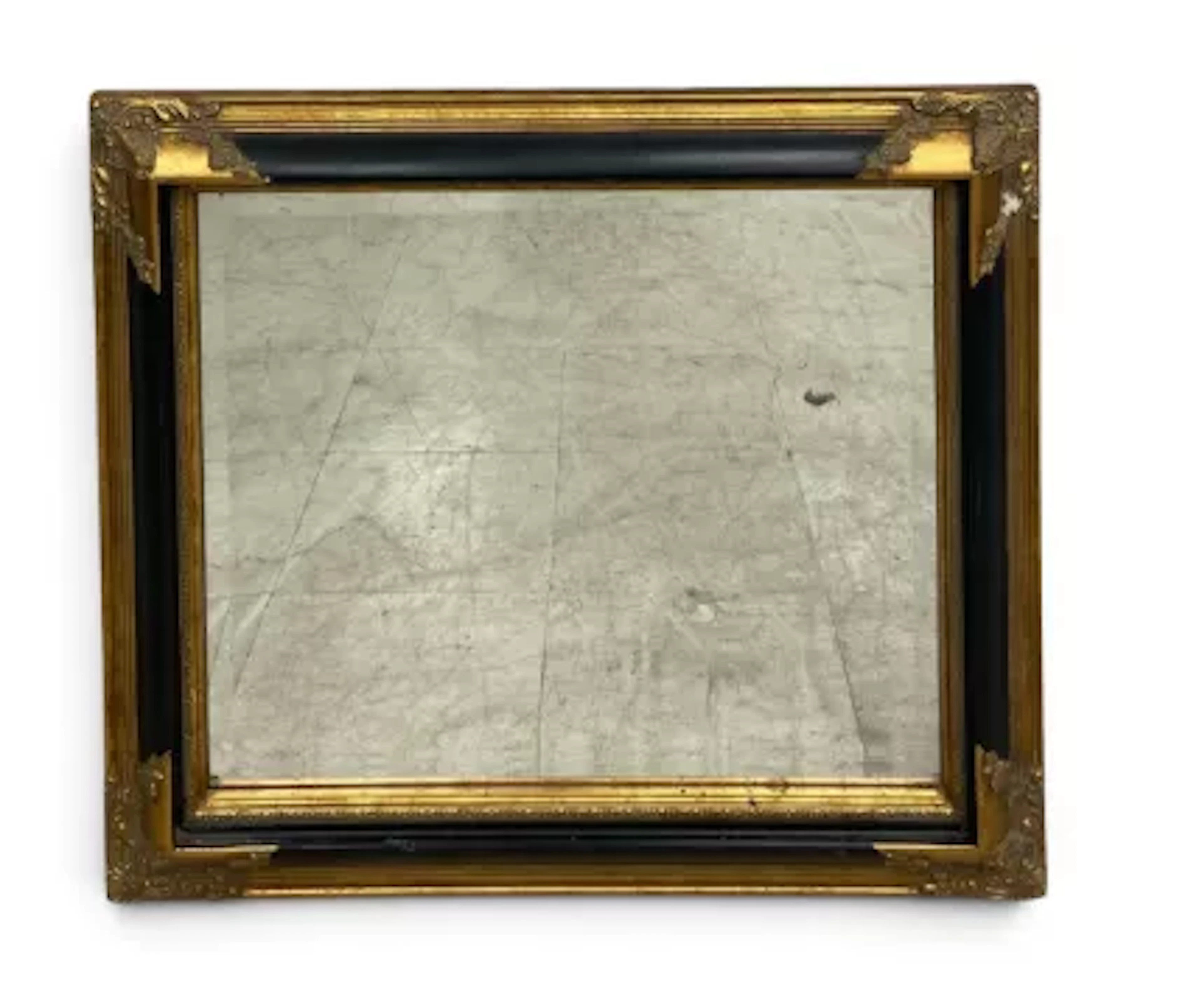 A 19th century style wall mirror, ebonised frame with gilt foliate