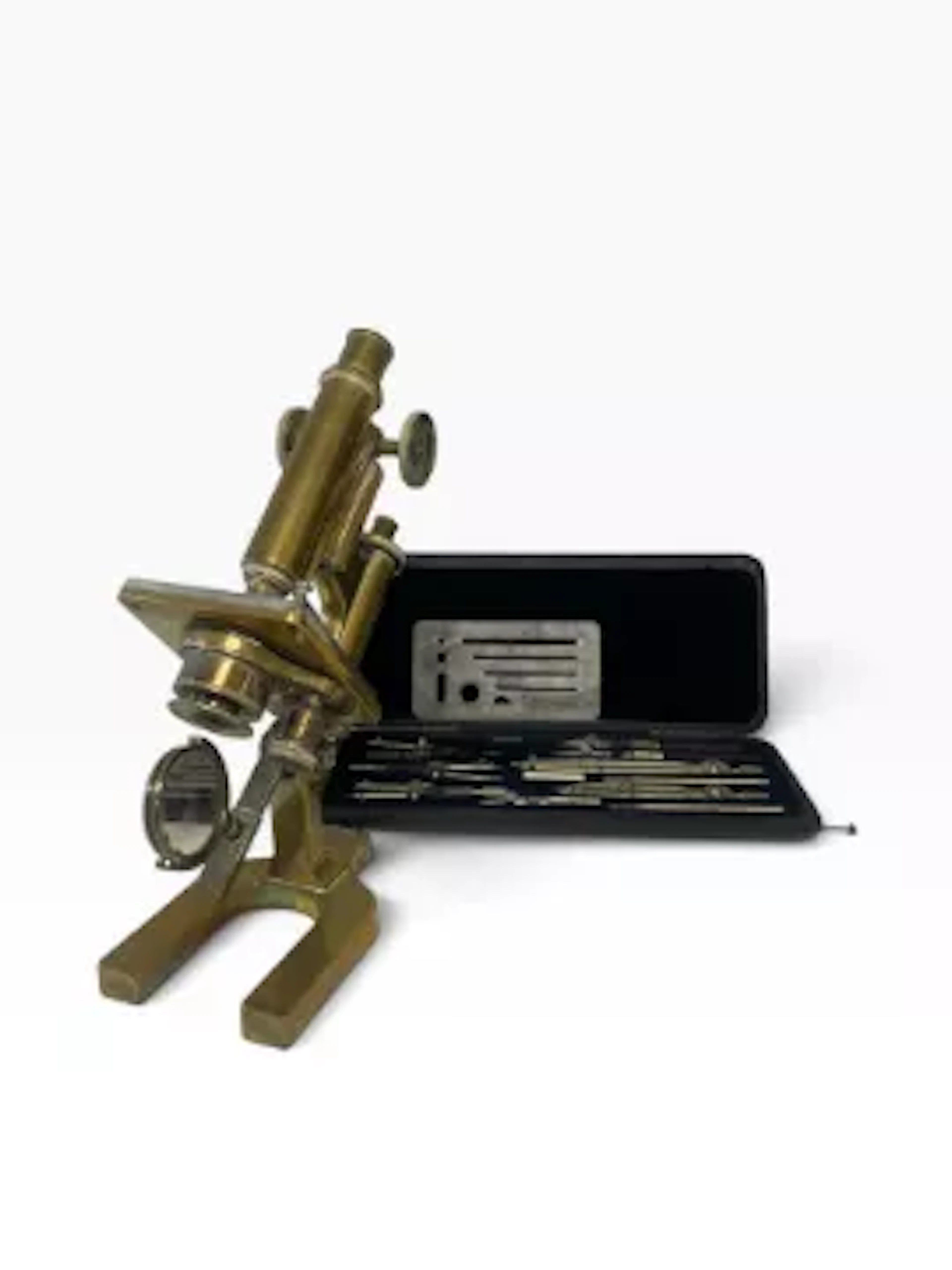 A 19th century lacquered brass microscope, stamped on the base '67