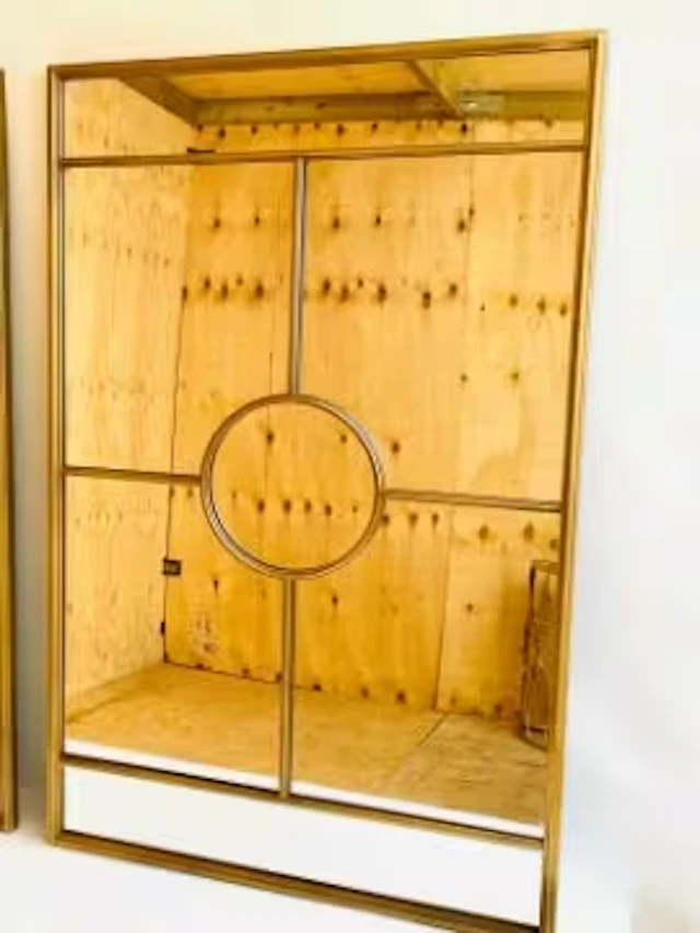 An architectural window style wall mirror in gilt metal frame. 110 x 70cm