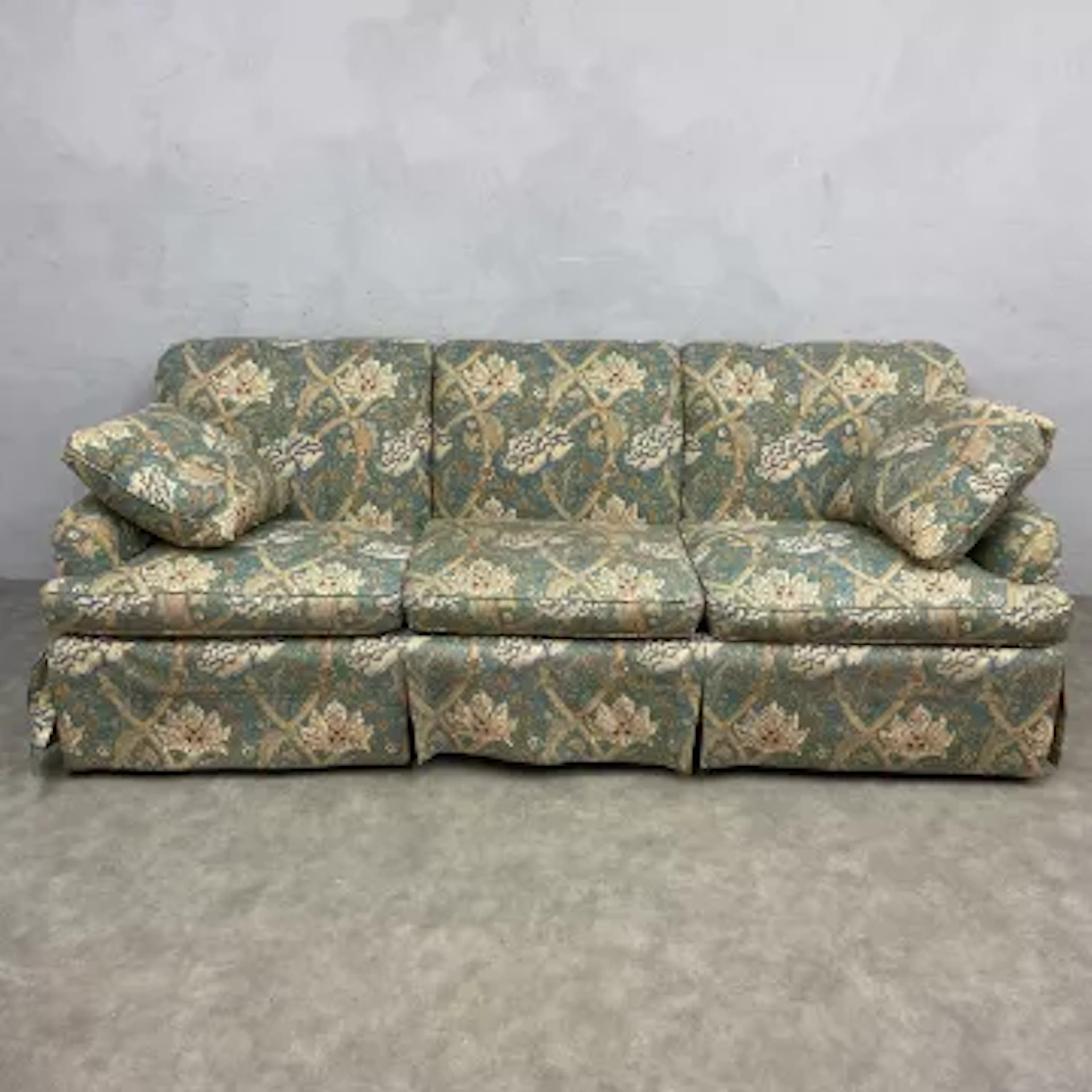 A contemporary Howard style three seater sofa in William Morris Windrush