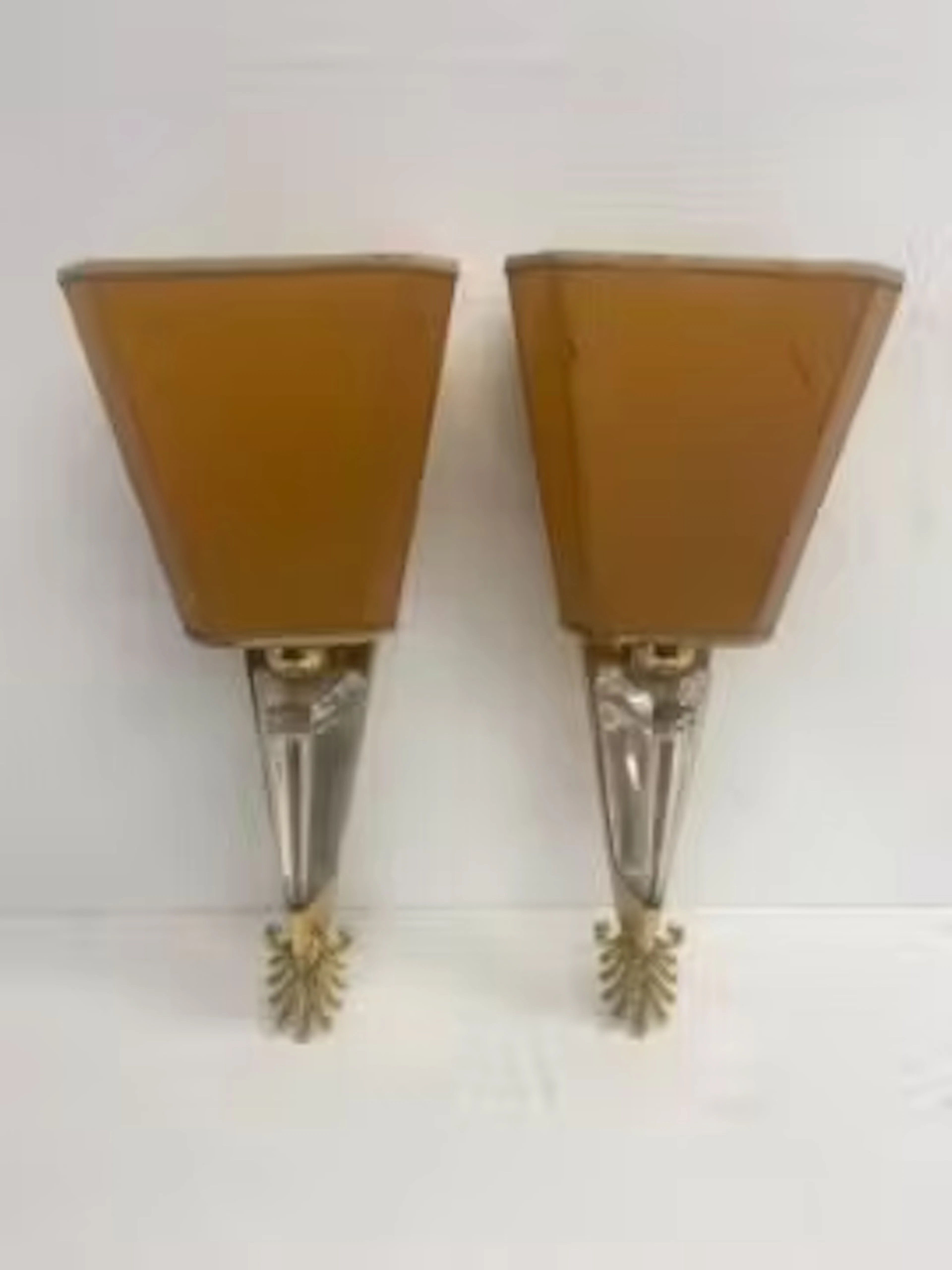 A pair of 1960's vintage Hollywood Regency style wall lights in brass