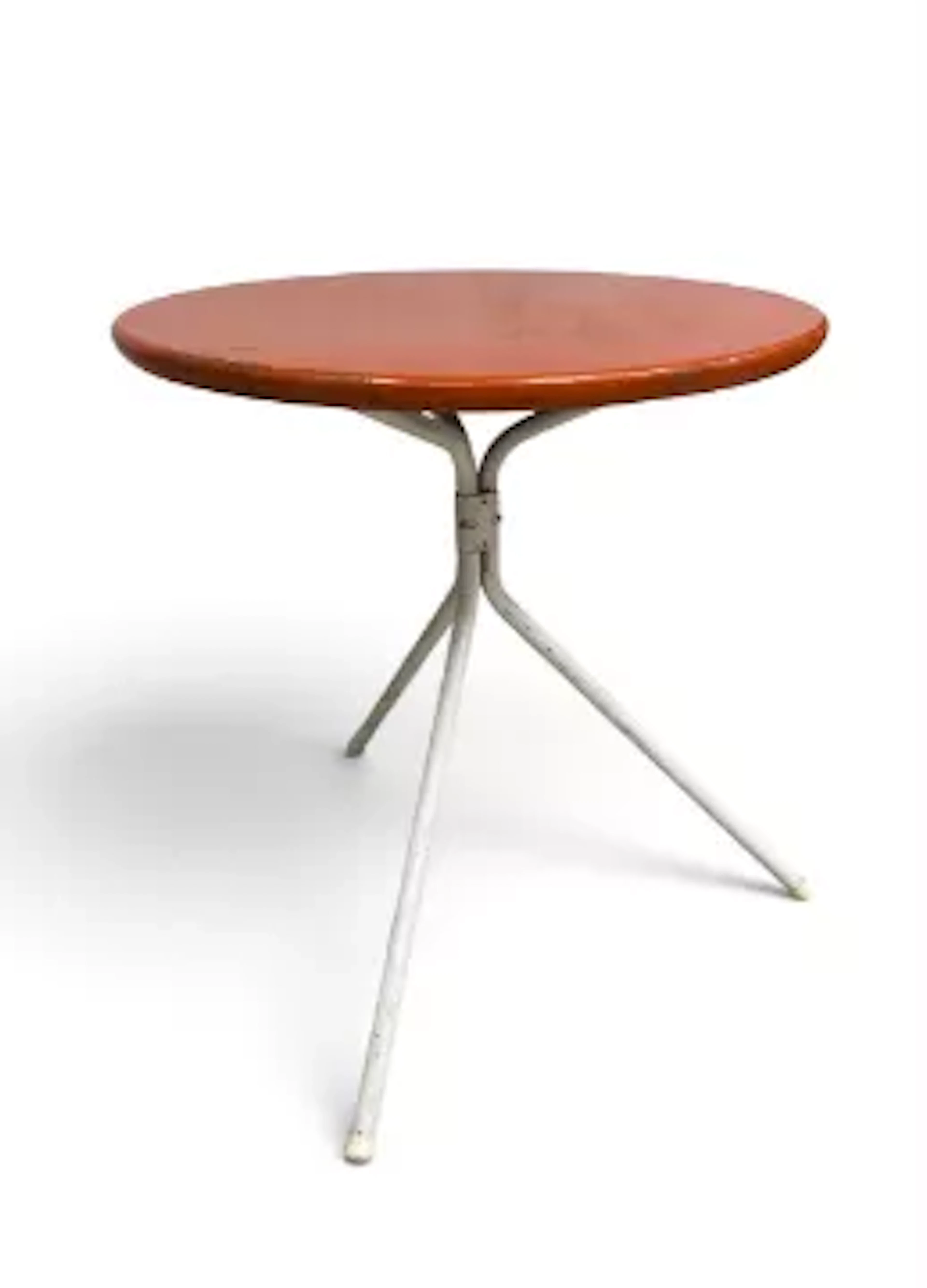 A vintage French metal folding bistro table and a metal framed garden