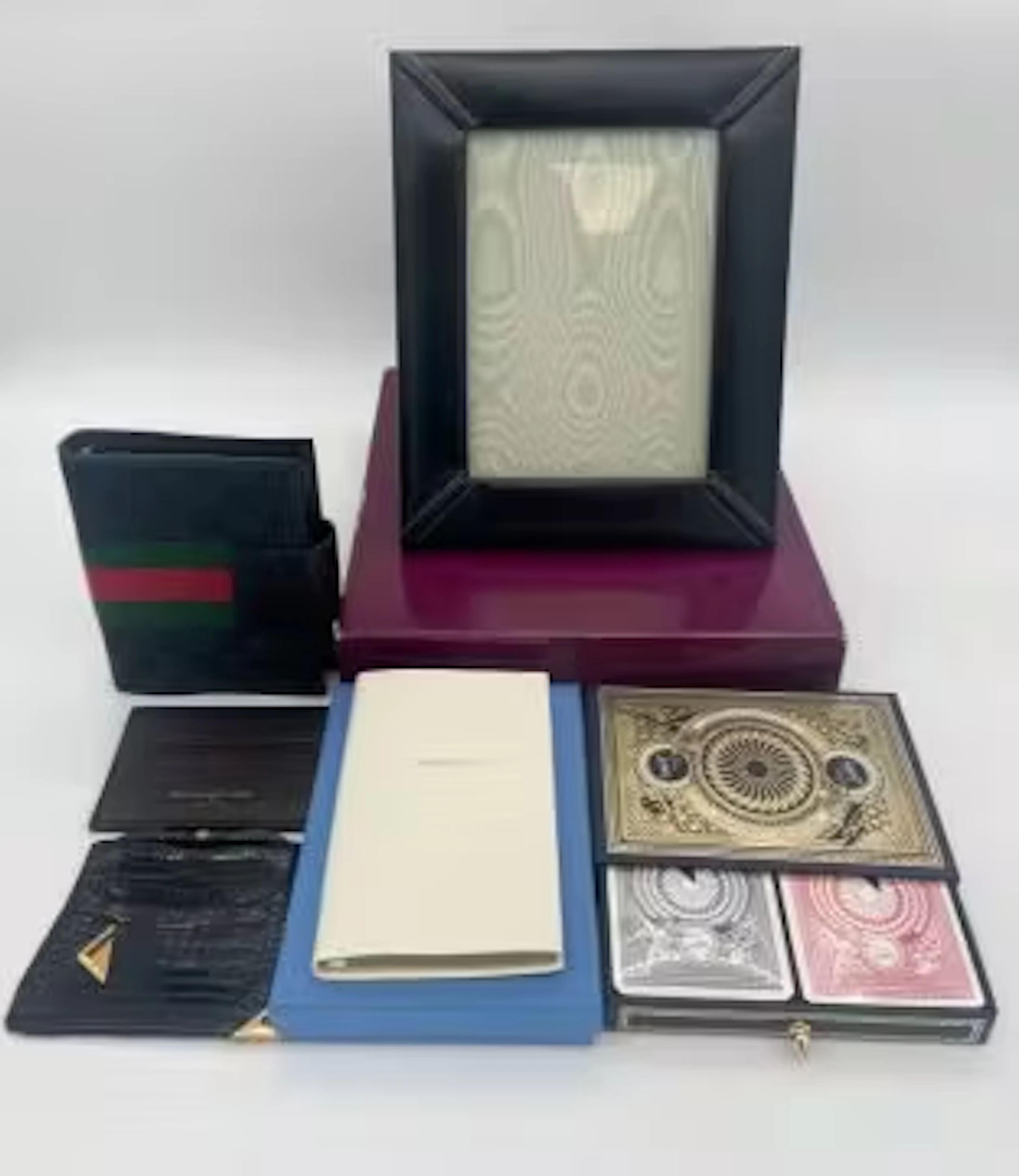 A collection of small leather goods to include an Asprey & Garrard