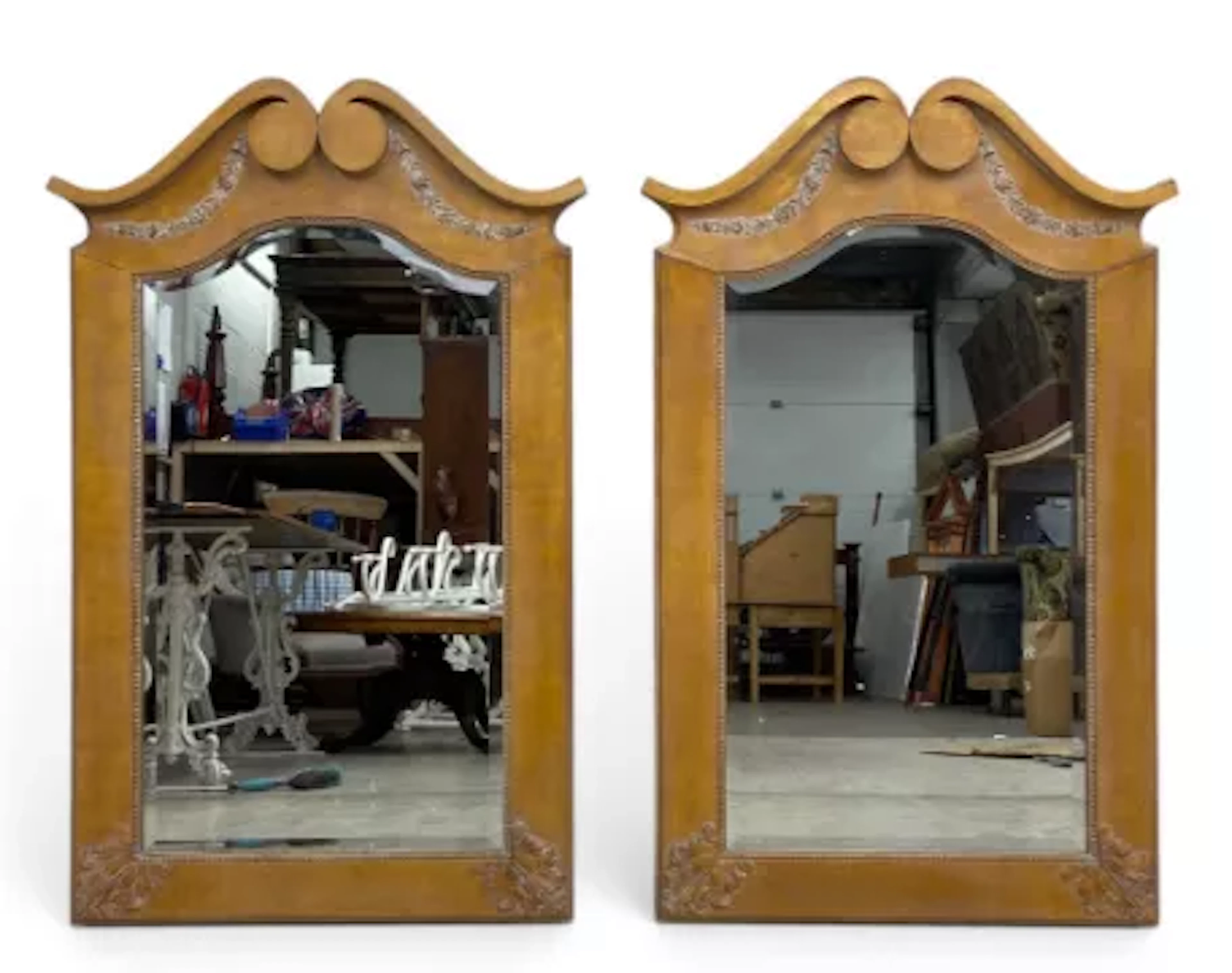 A pair of contemporary pier mirrors each with a scrolled pediment
