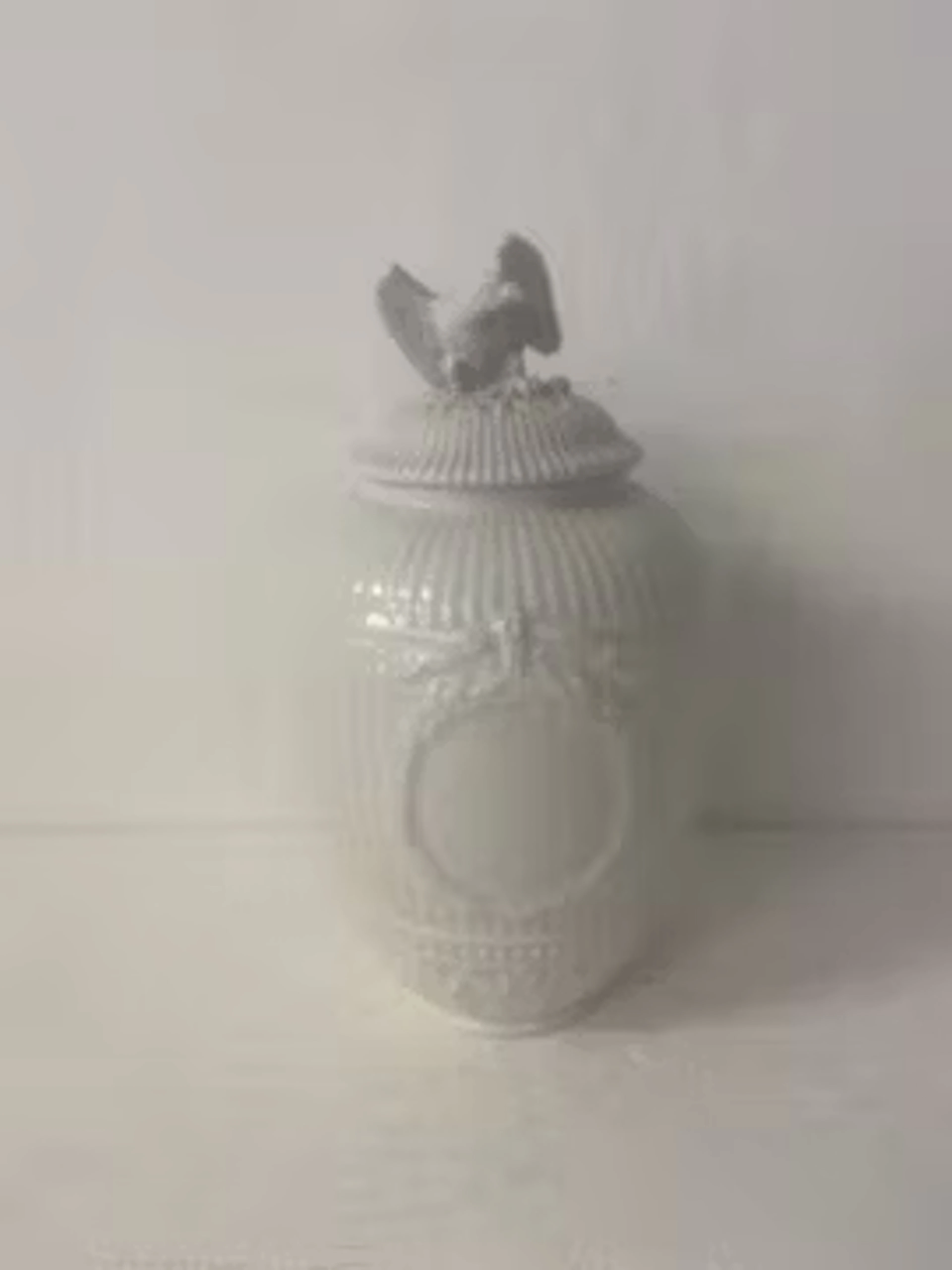 An early 20th century blanc de chine porcelain potpourri vase with