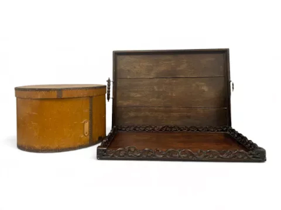 A pair of early 20th century nesting hat boxes in bentwood with patterned