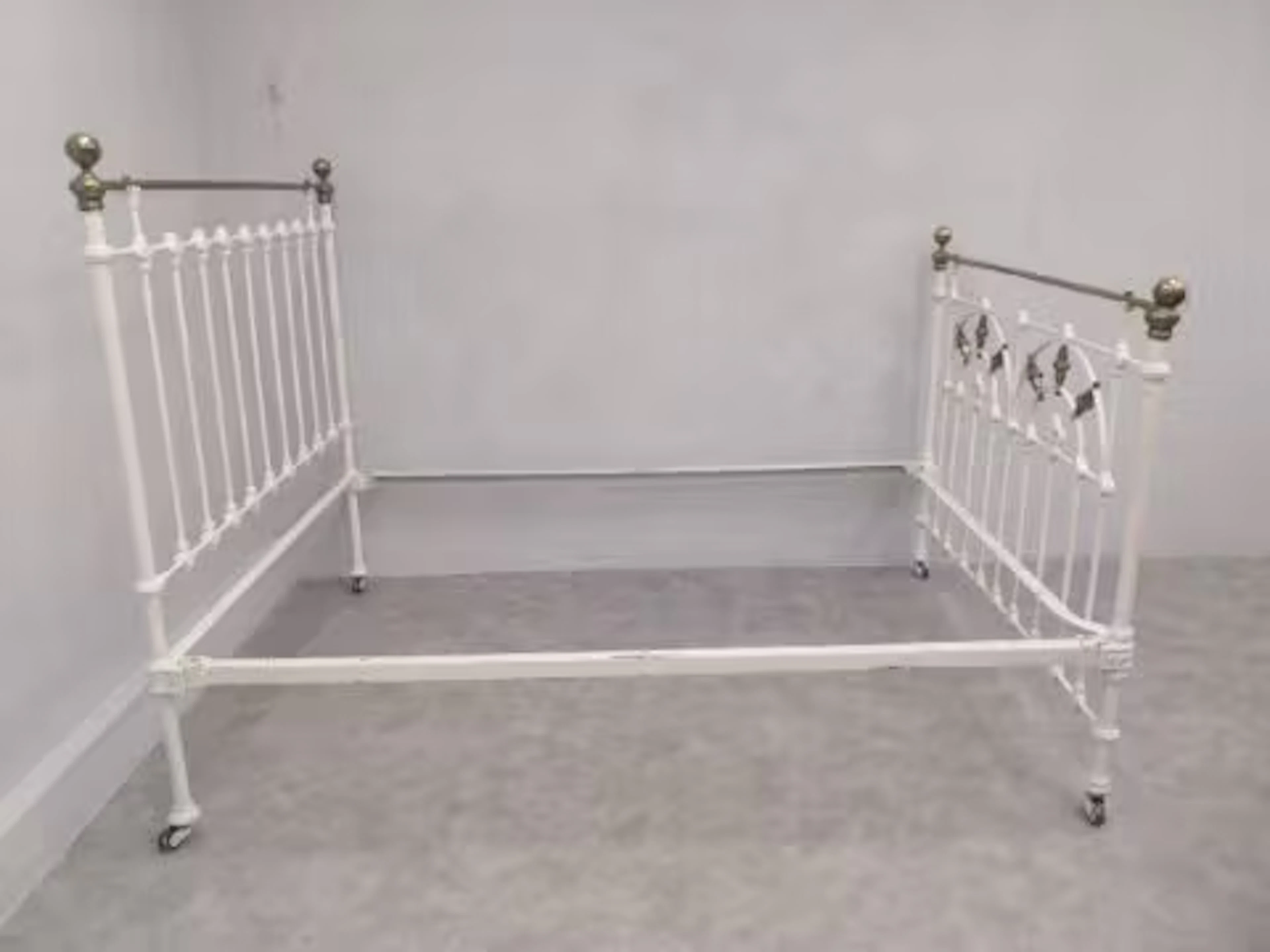 A Victorian brass and iron double bedstead to take a 4' 6" mattress.