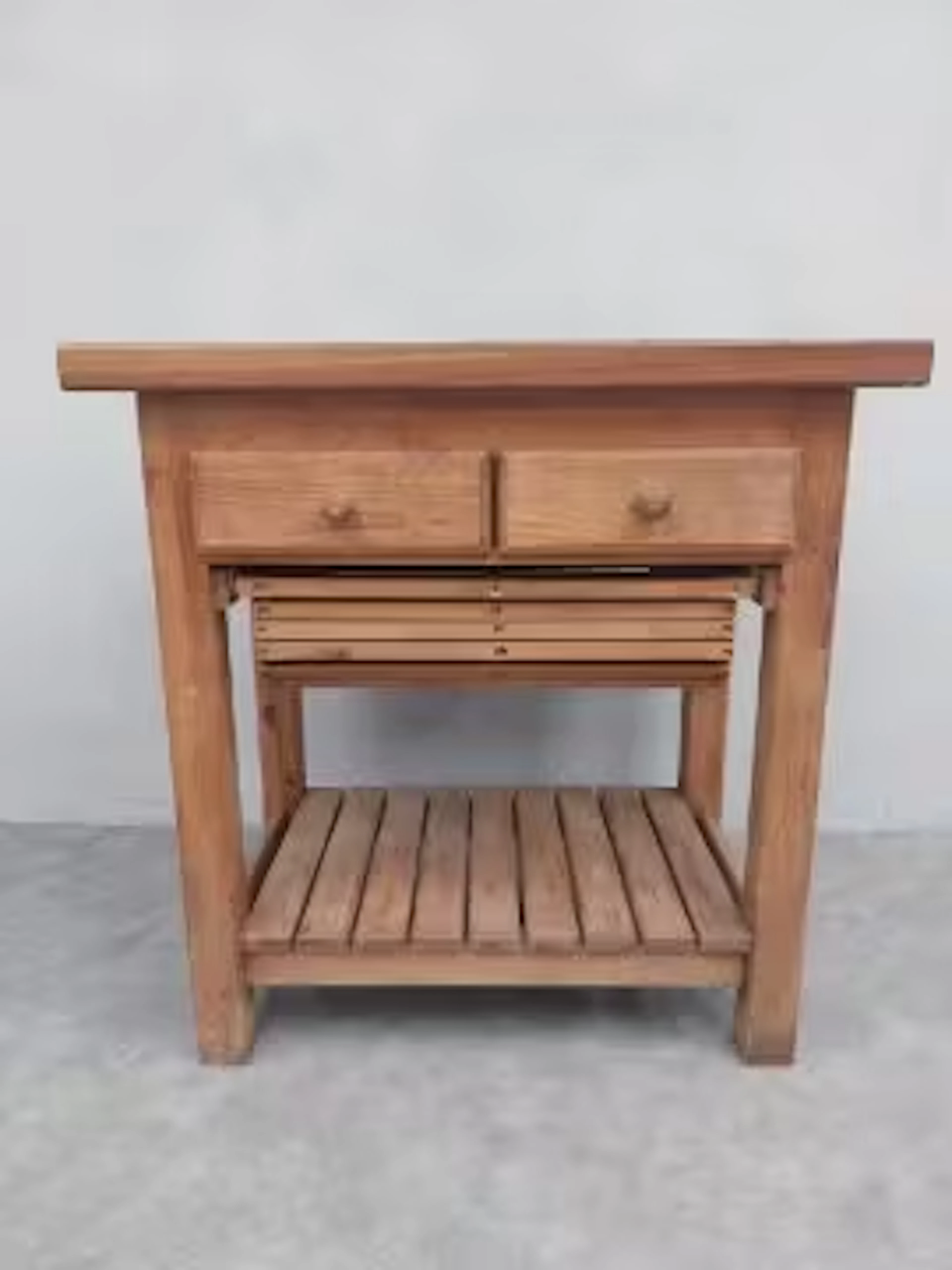 A Victorian style teak and pine butchers block type kitchen table.