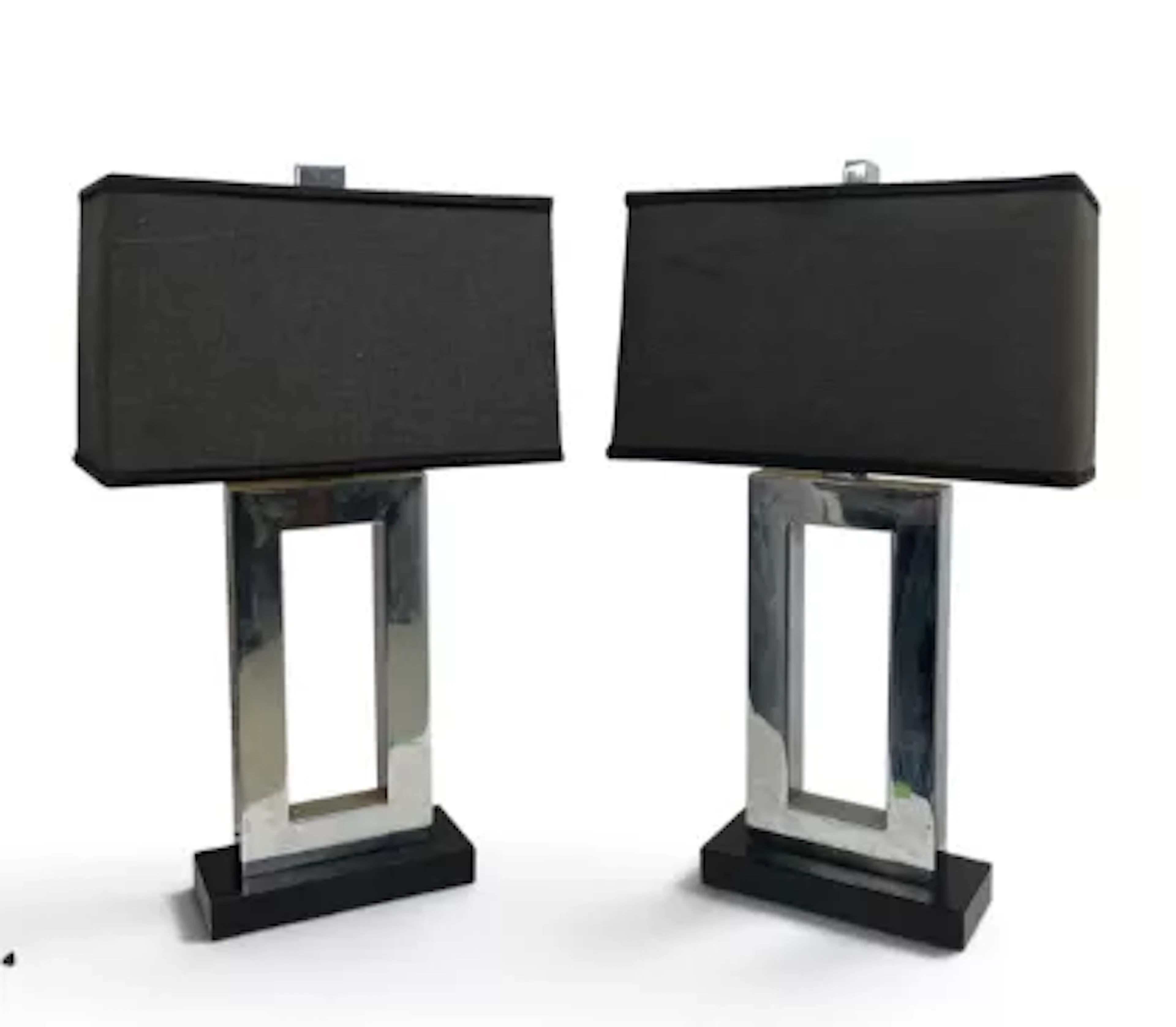 A pair of large Andrew Martin table lamps, chrome and black metal