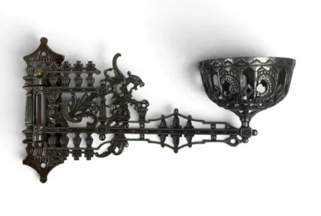 A pair of 19th century cast metal wall mounted swing-arm gas burner