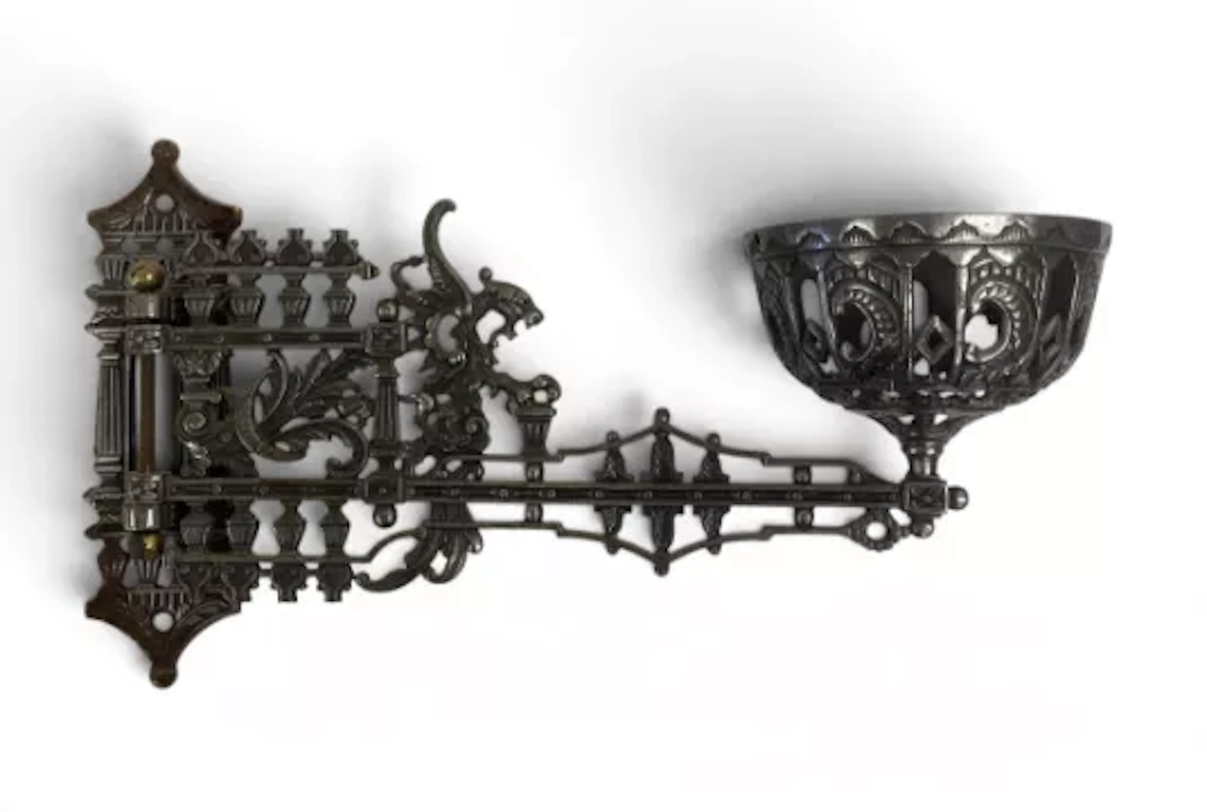 A pair of 19th century cast metal wall mounted swing-arm gas burner