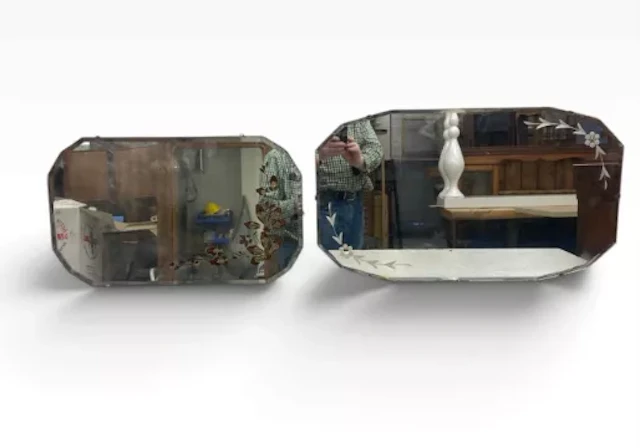 A vintage bevelled and etched wall mirror and a painted decorated