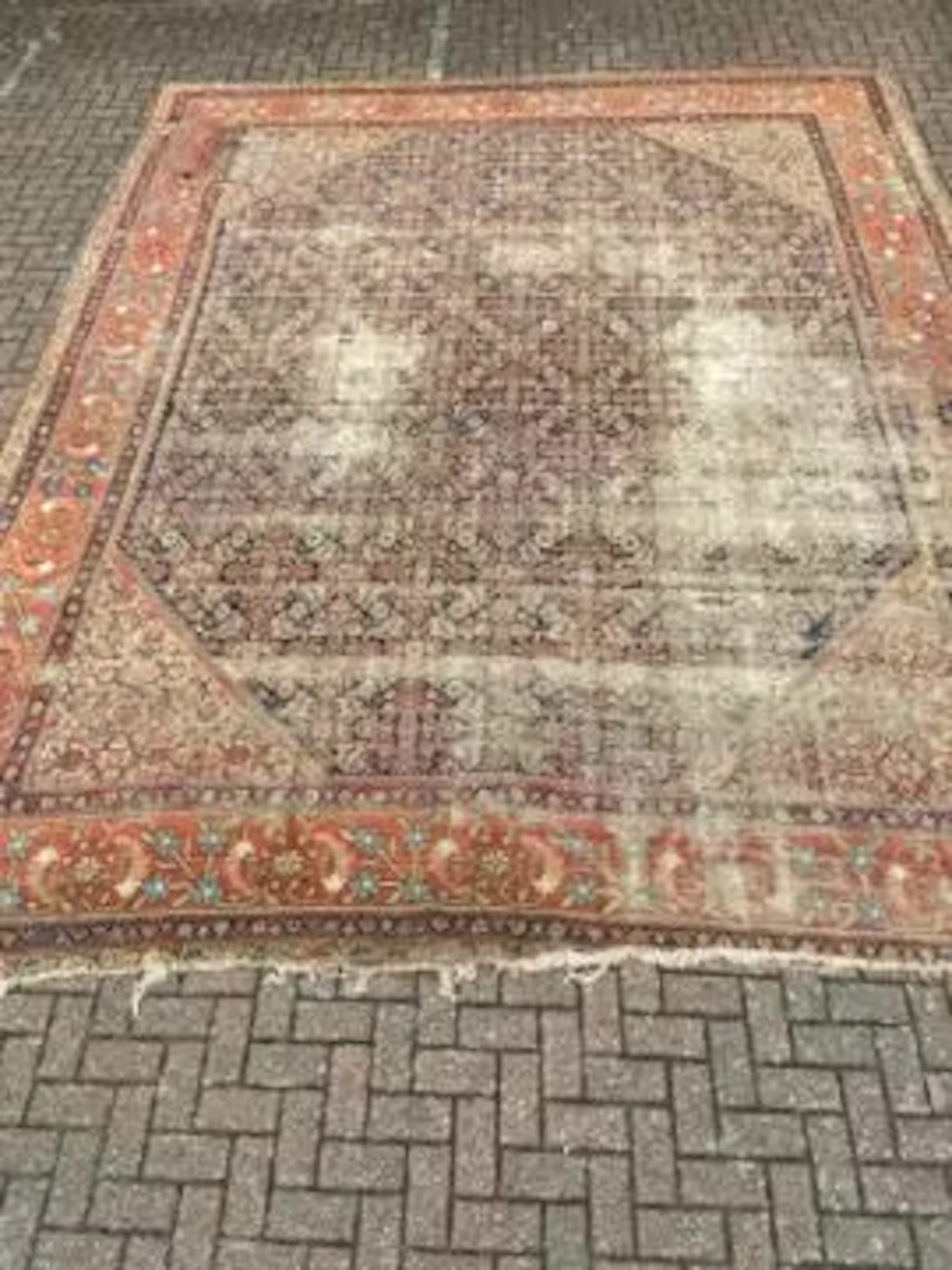 An Eastern palace carpet with geometric pattern across the field within