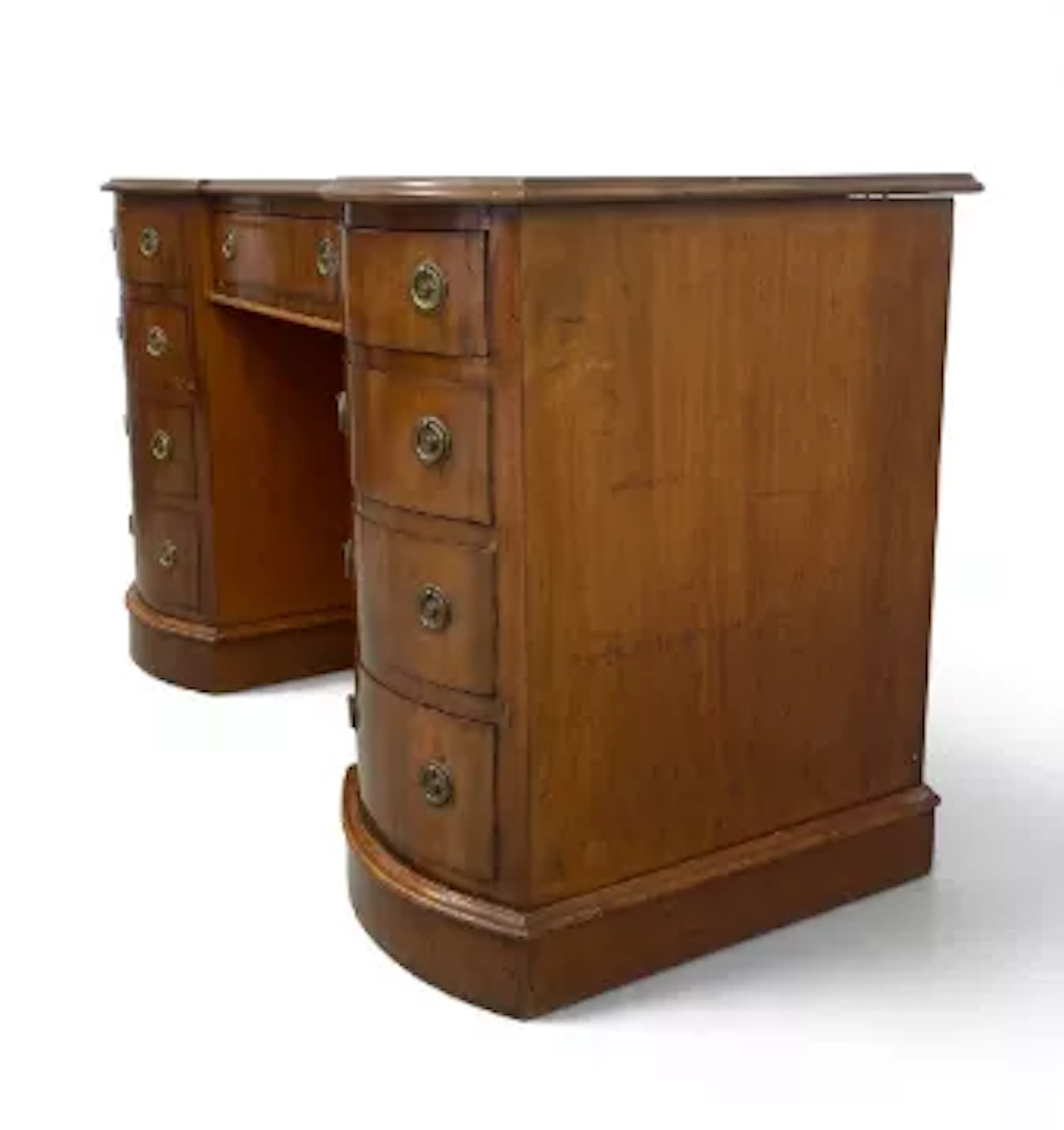 A C.1900 mahogany twin pedestal desk having a gilt and tooled red