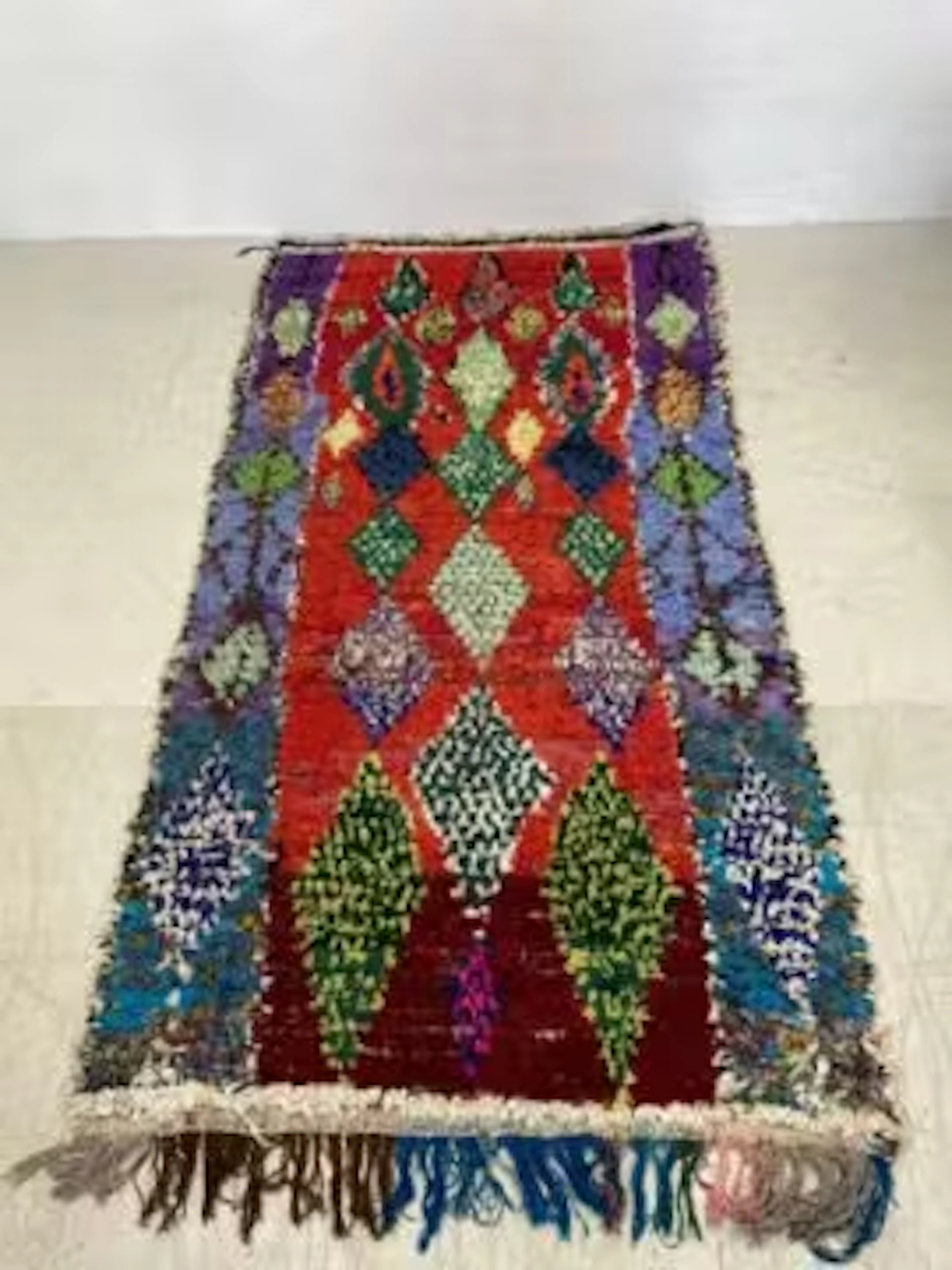 A large 20th century Moroccan or Berber Boucherouite carpet hand woven