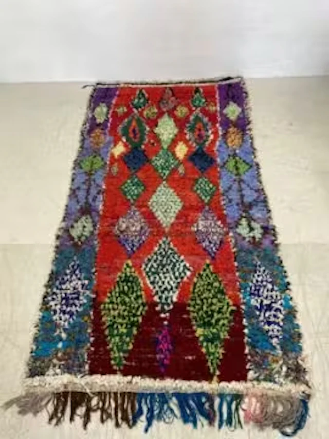 A large 20th century Moroccan or Berber Boucherouite carpet hand woven