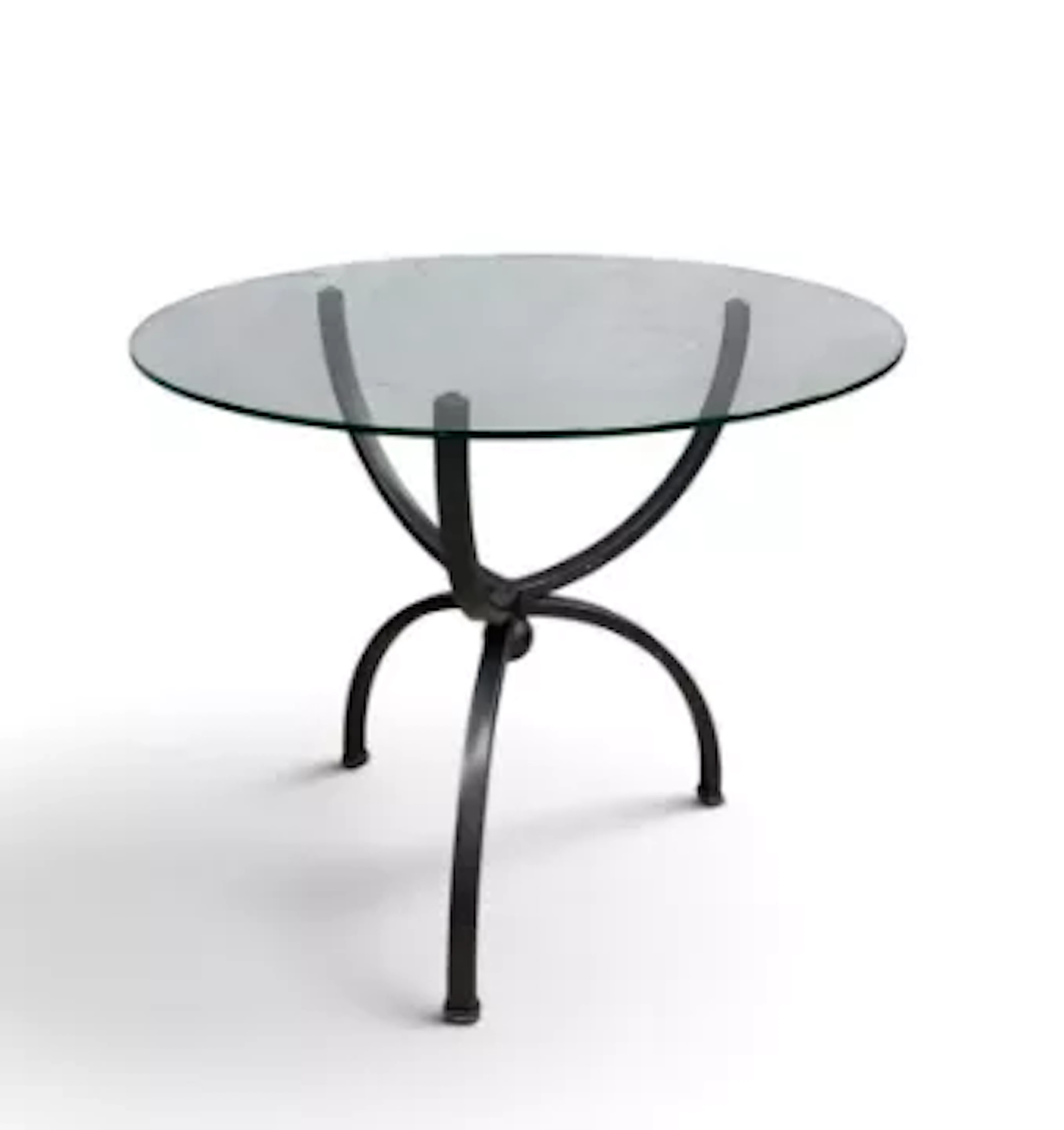 A contemporary side table, circular glass top with pewter effect base