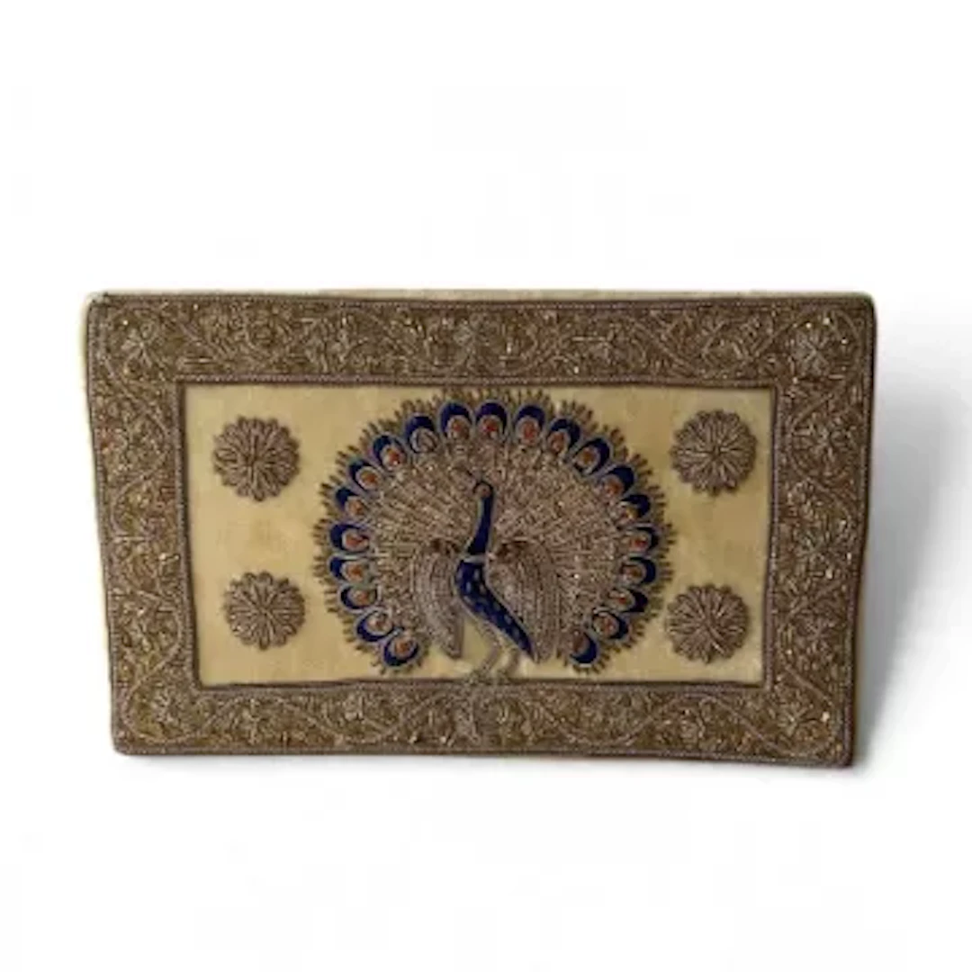 A vintage clutch bag, hand-embroidered beadwork detailing with a decorative