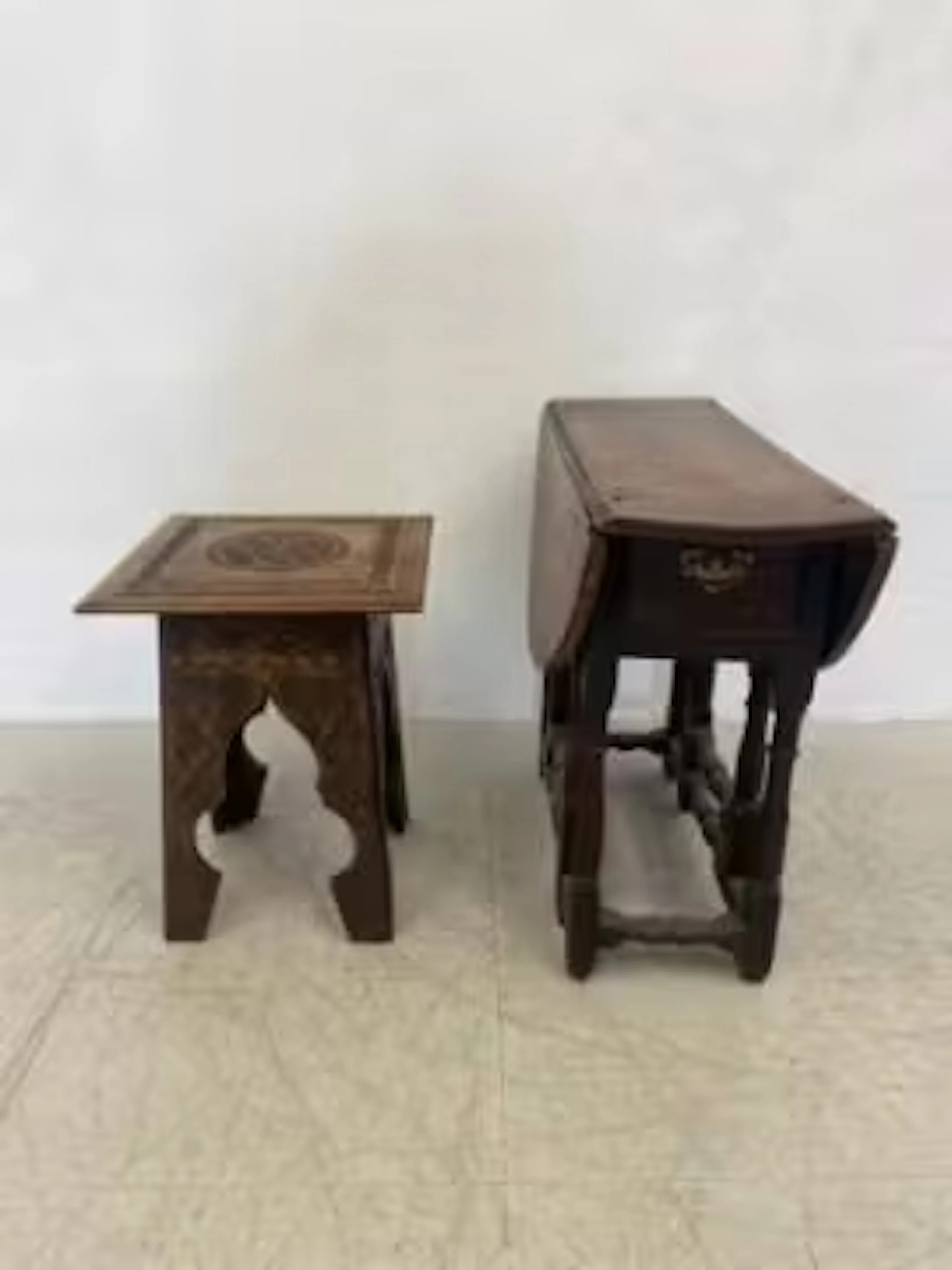 A carved Eastern occasional table and an 18th century country oak