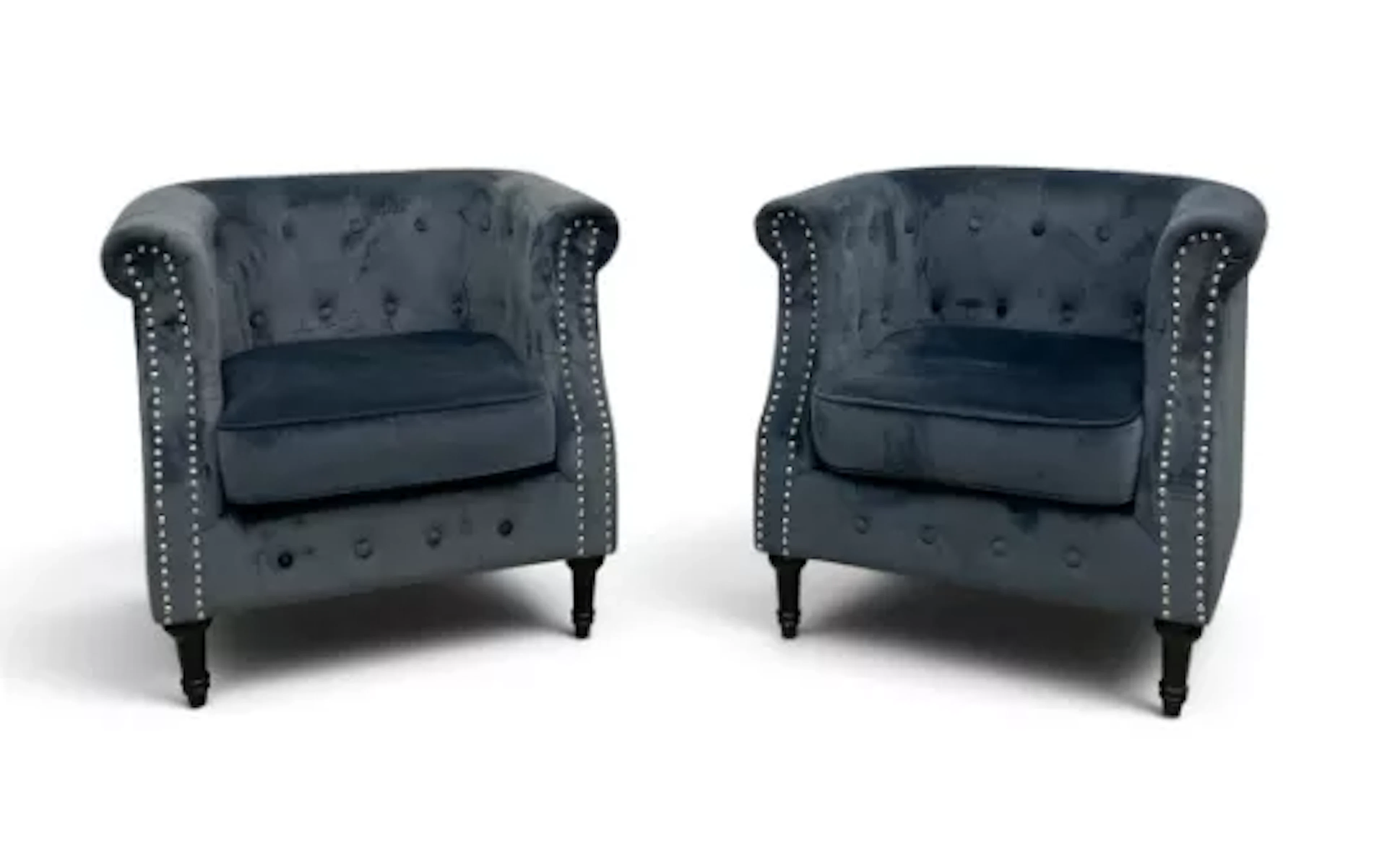 A pair of contemporary tub armchairs in buttoned velour on turned