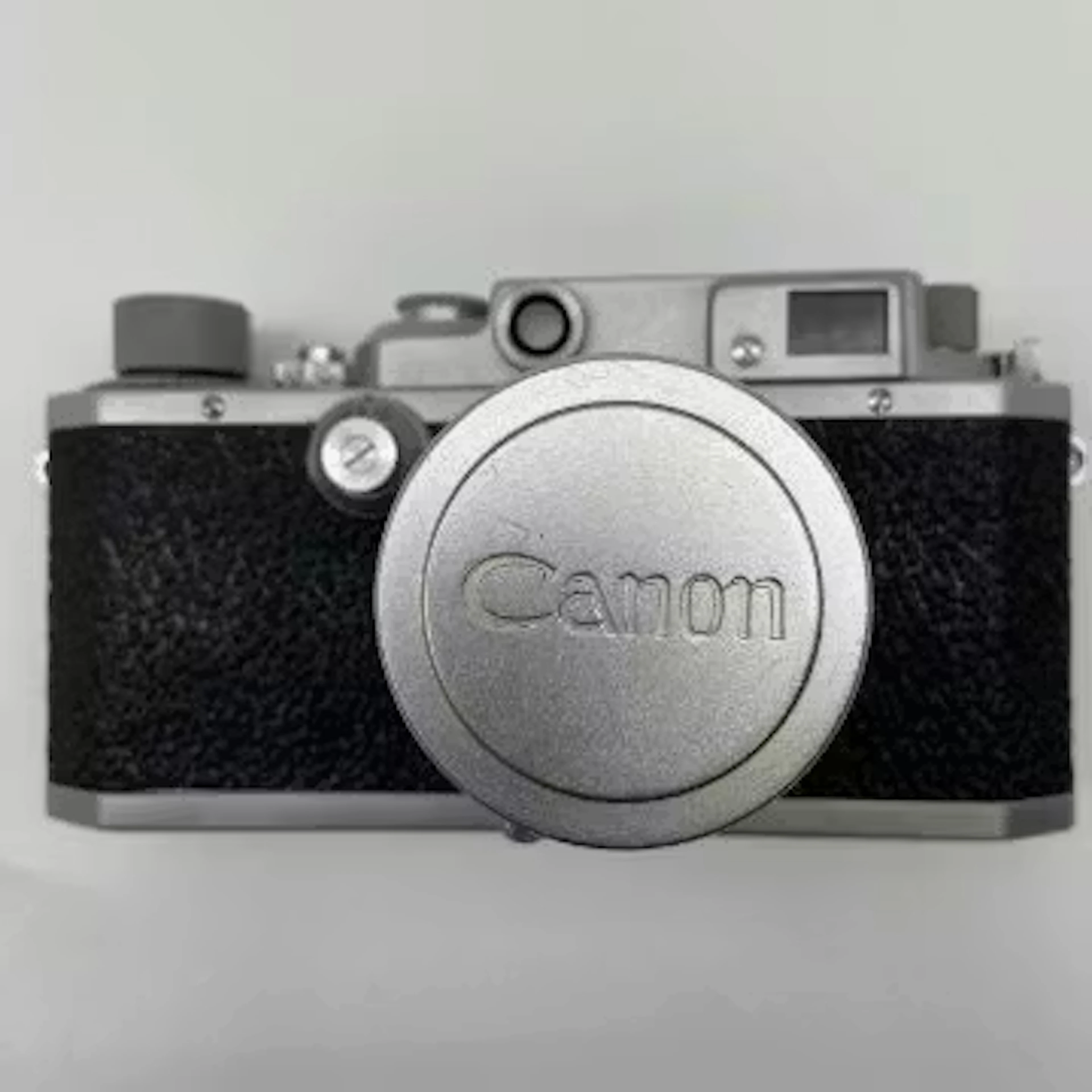 A 1950s vintage Japanese metal cased bottom-loading Canon Camera Co.