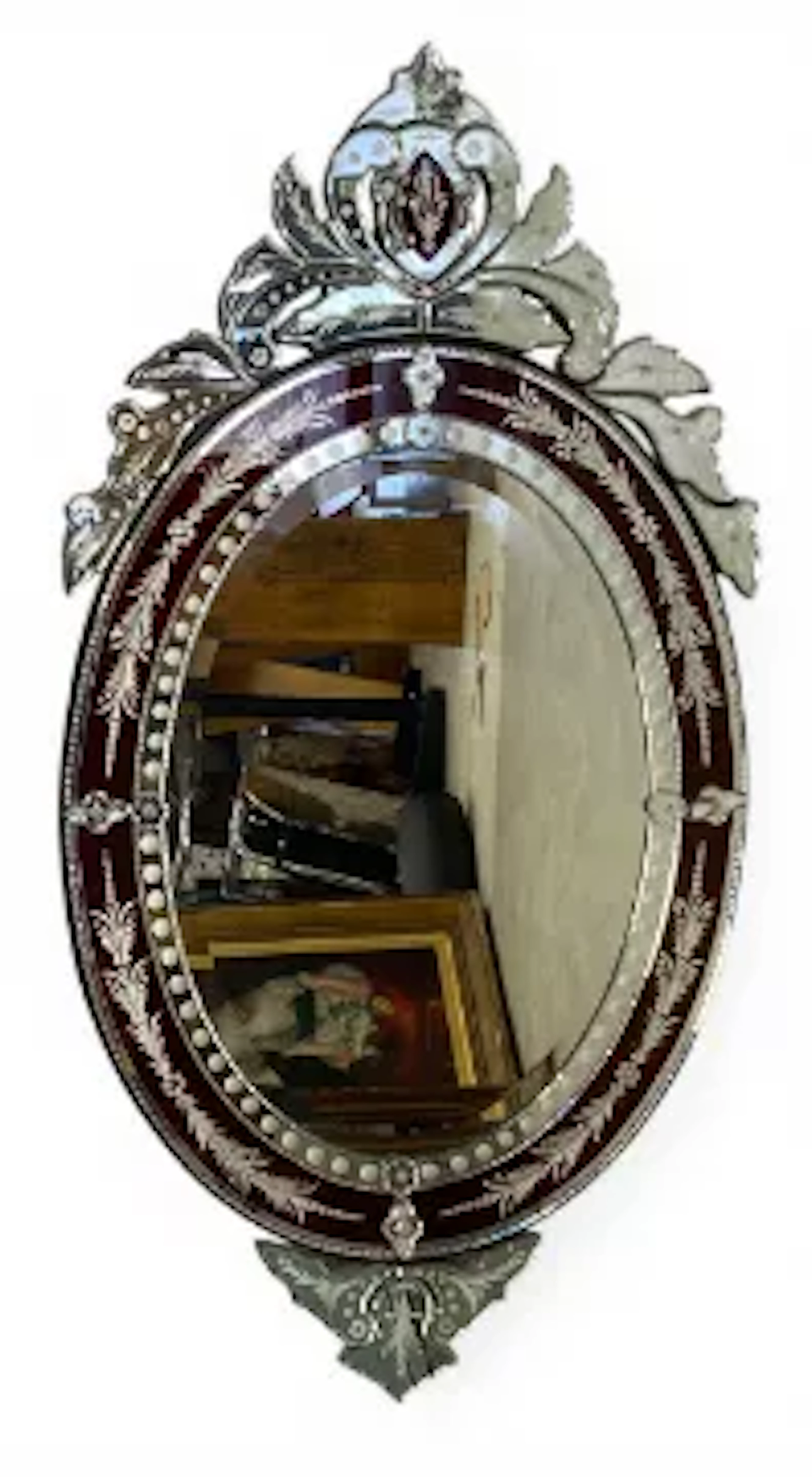 A large vintage Venetian style wall mirror with scrolling foliate