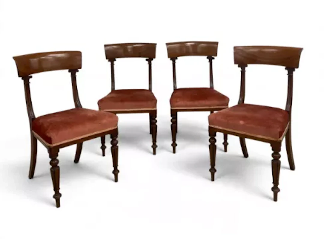 A set of four William IV mahogany bar back dining chairs with acanthus