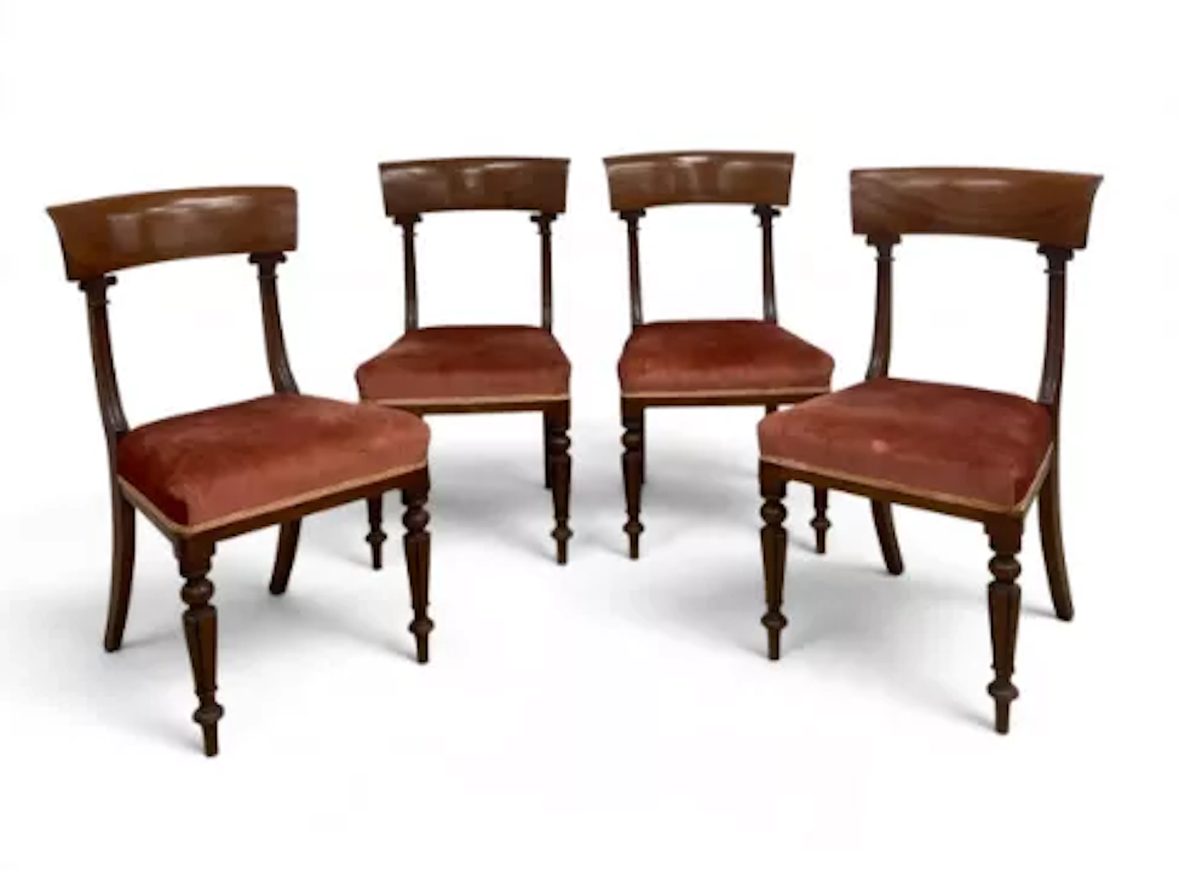 A set of four William IV mahogany bar back dining chairs with acanthus