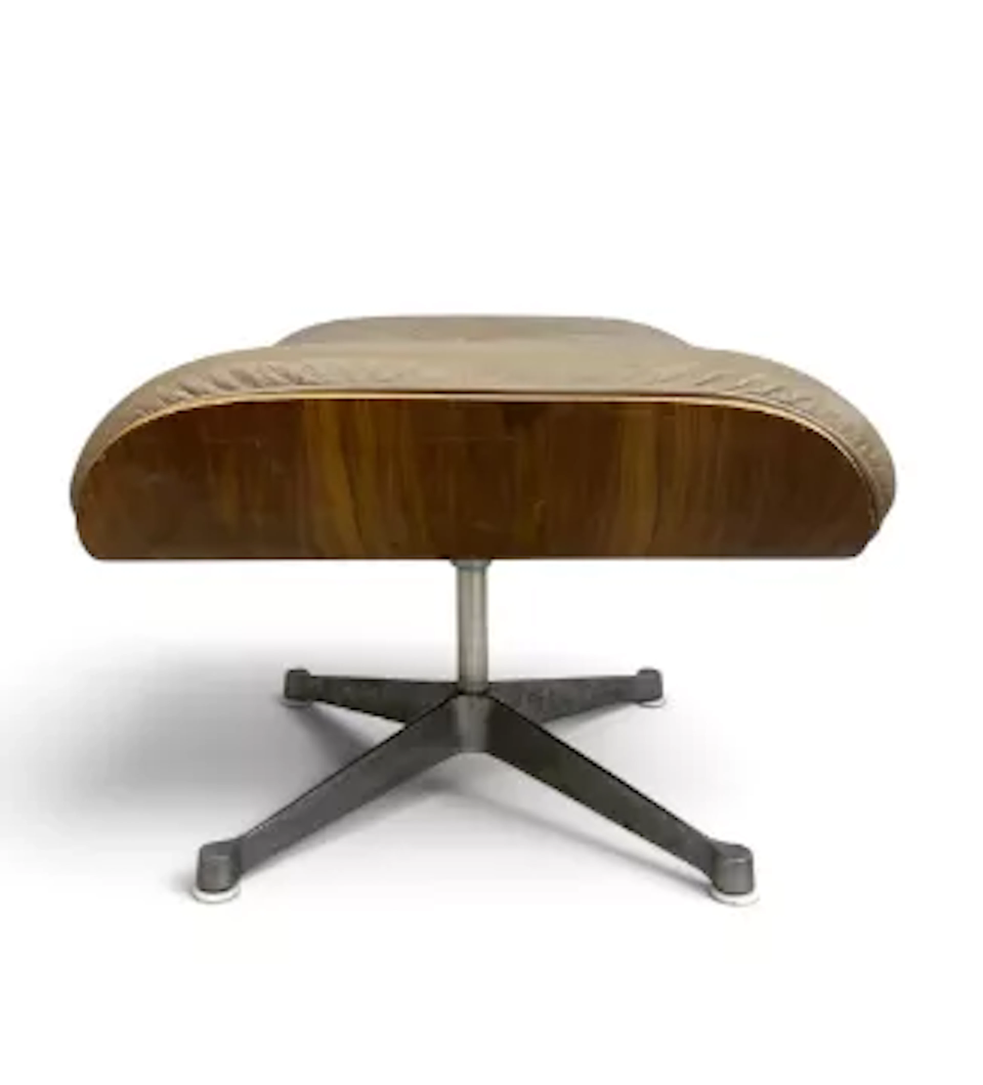 A vintage Charles and Ray Eames model 671 leather upholstered ottoman