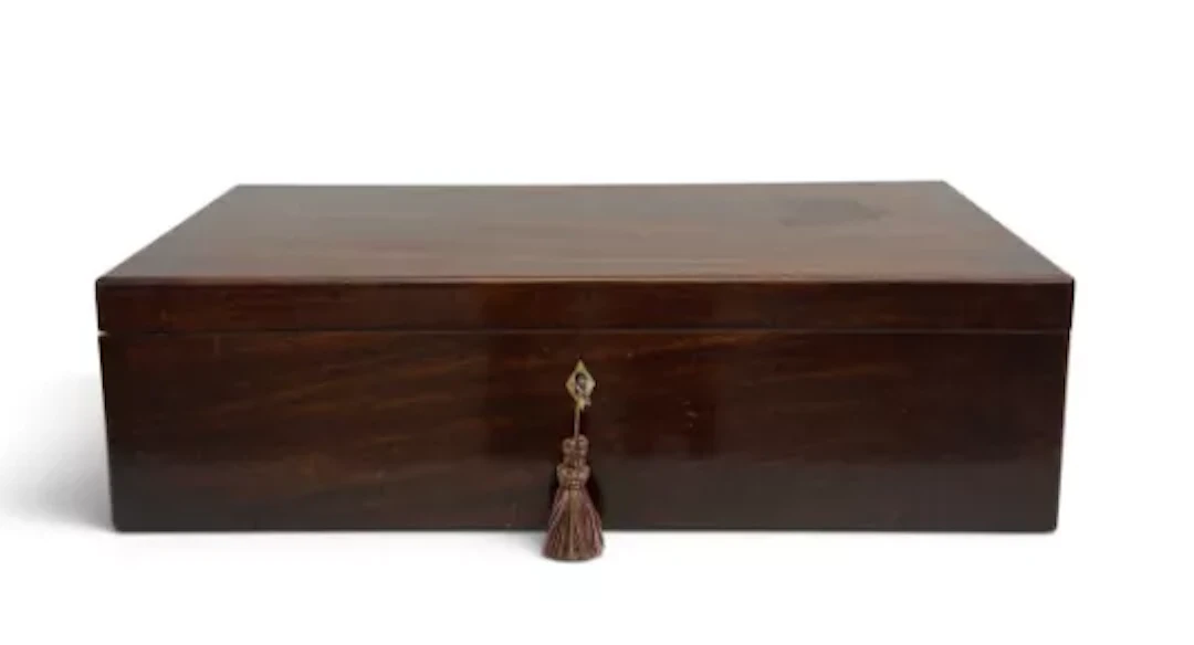 A large Georgian Cuban mahogany writing slope with fitted interior