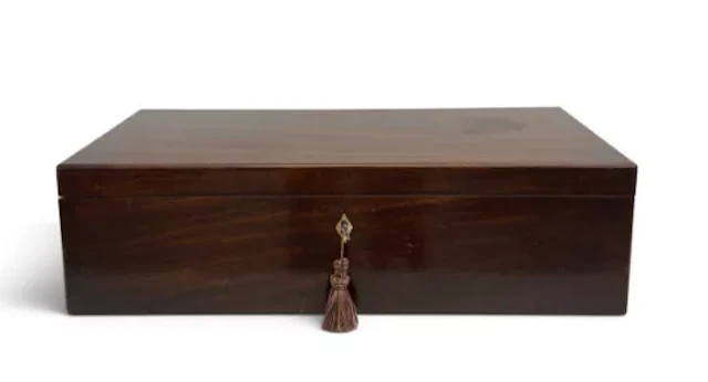 A large Georgian Cuban mahogany writing slope with fitted interior