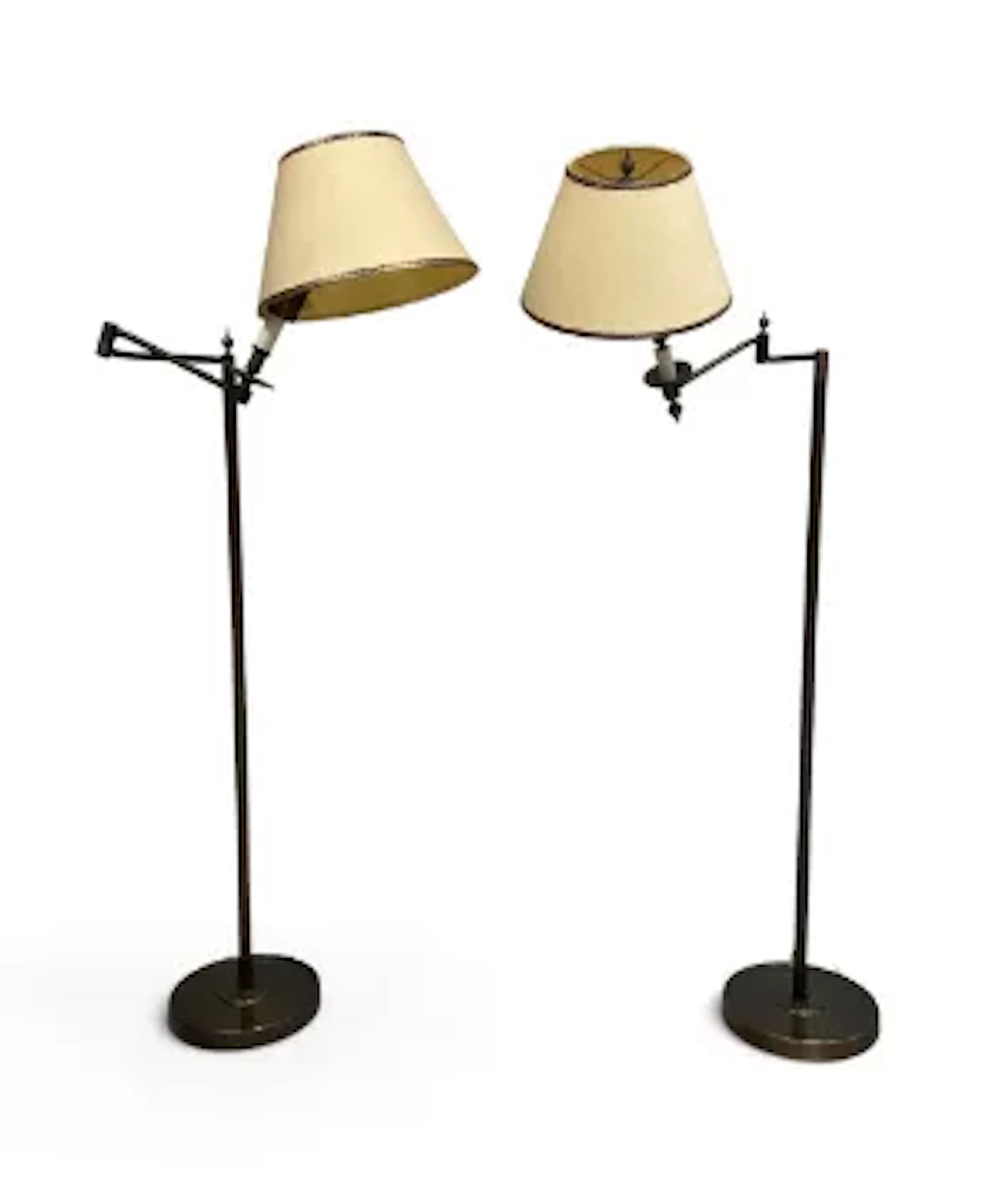 A pair of bronzed metal full height floor standing reading lamps with