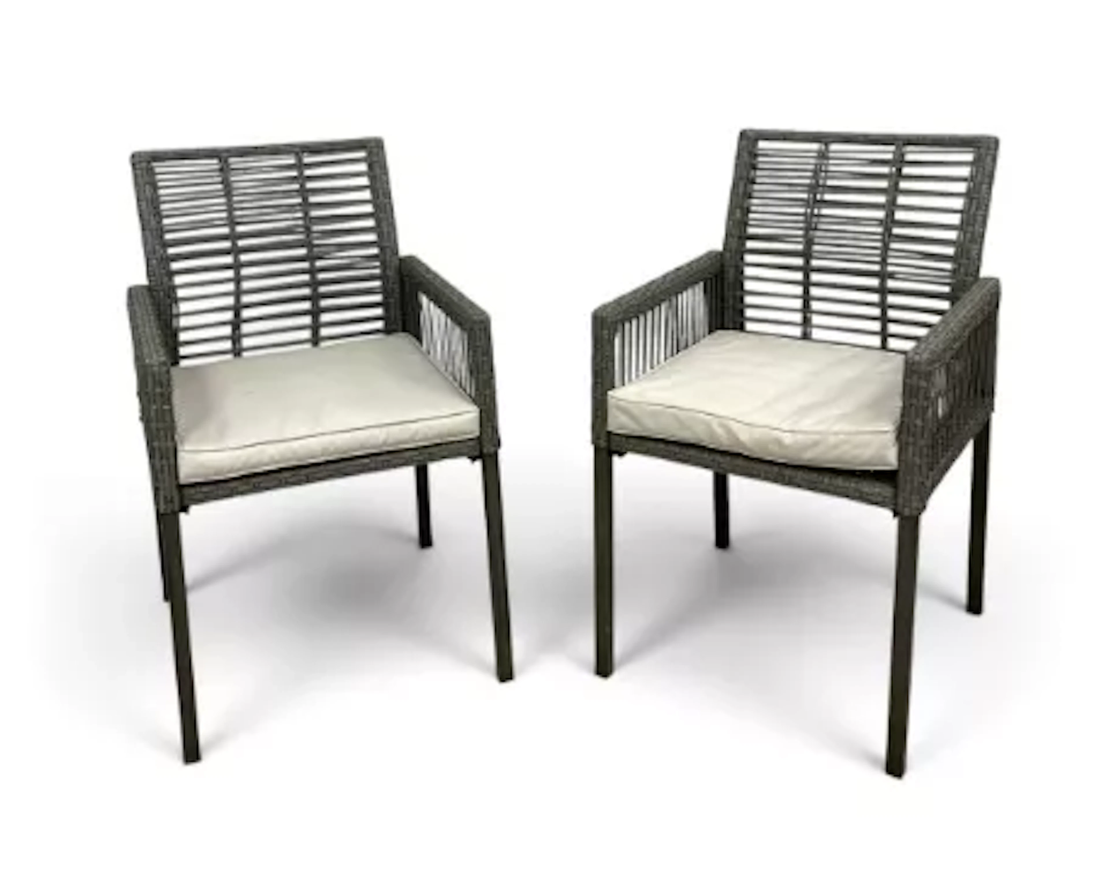 A contemporary pair of wicker armchairs, slatted backs with drop-in
